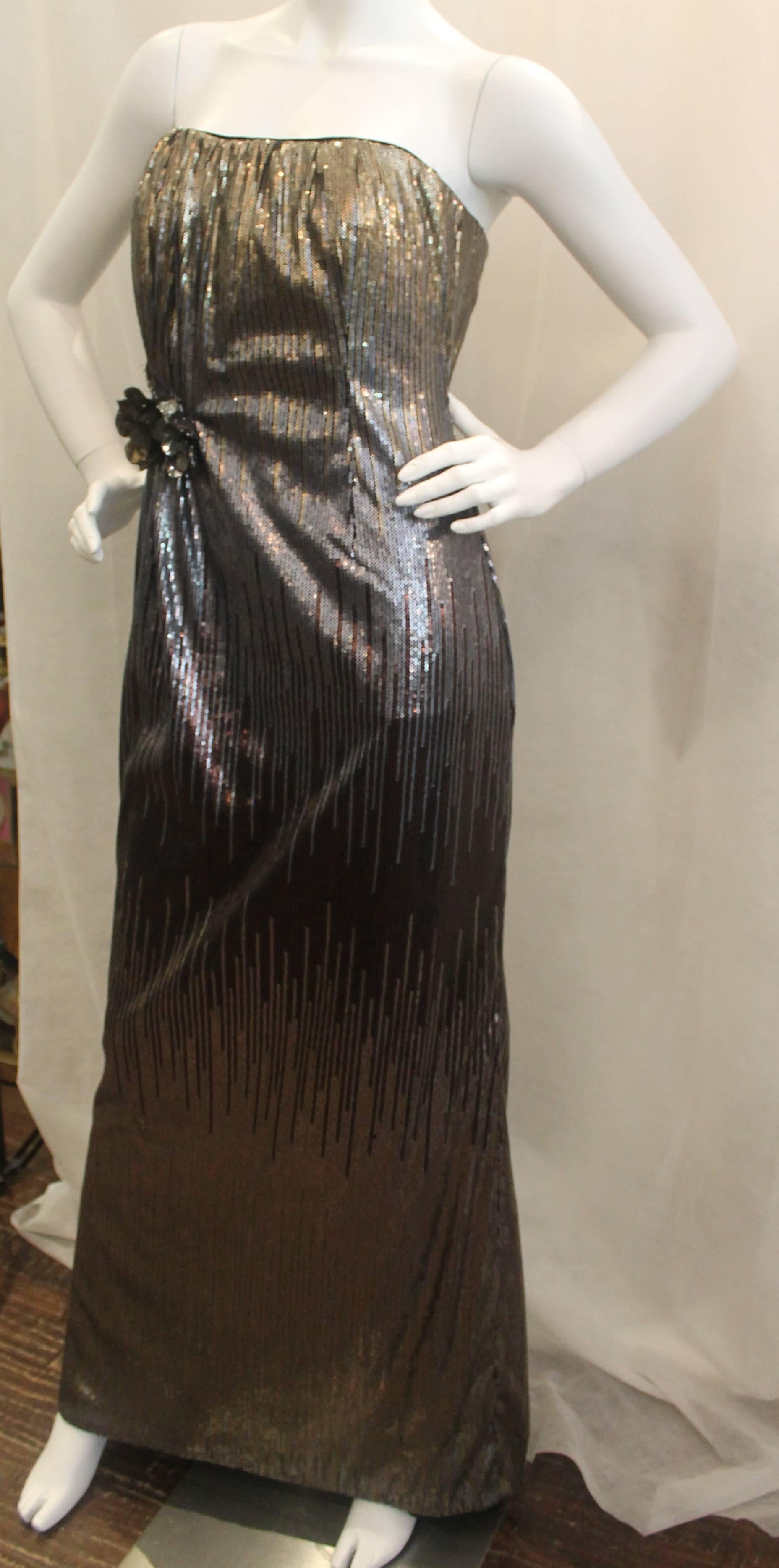 Badgley Mischka Metallic Sequin Strapless Gown with Flowers - 8. This gown is in very good condition with a few areas missing a sequins, with the area shown in the images being the largest. The sequins fade into different colors going from gold to