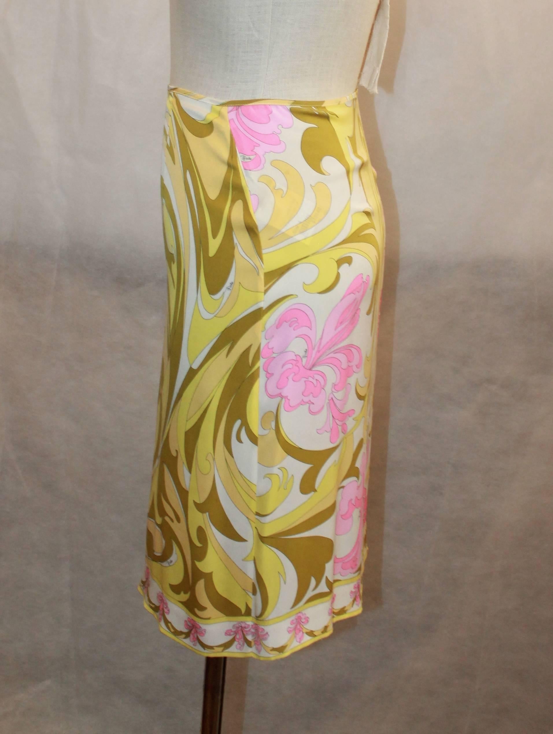 Emilio Pucci Yellow, Green & Pink Printed Skirt - 4 - 1980's. This skirt is in good vintage condition with some pulls consistent with the piece's age. It features a large print and a side zipper.

Measurements:
Waist- 27.5