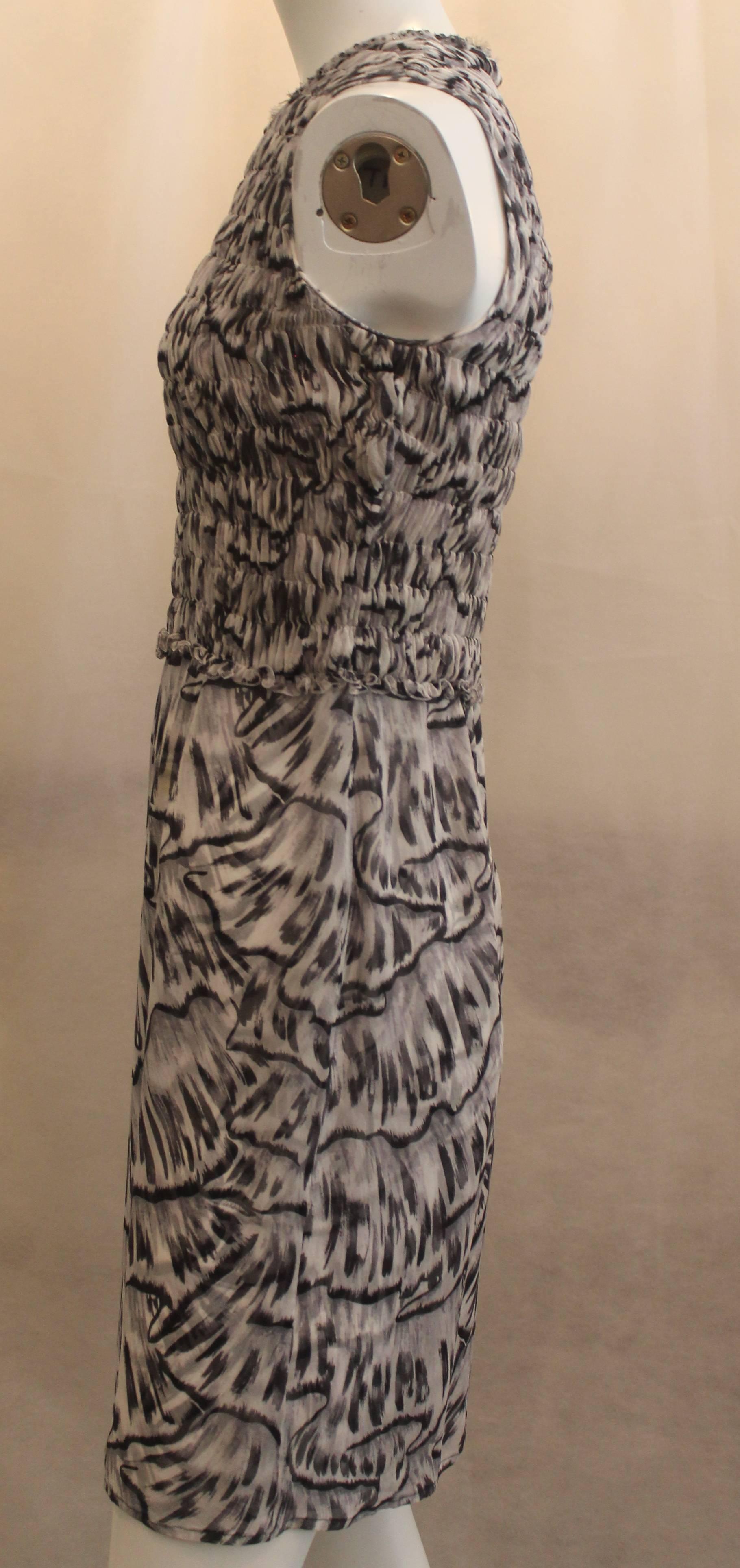 Bottega Veneta Silk Gray Animal Printed Sleeveless Ruched Dress - 40. This dress features black embezzlement on the neckline, a ruched bodice, and a sheer bottom. It has a black and dark gray animal print. It is is good condition. There is one