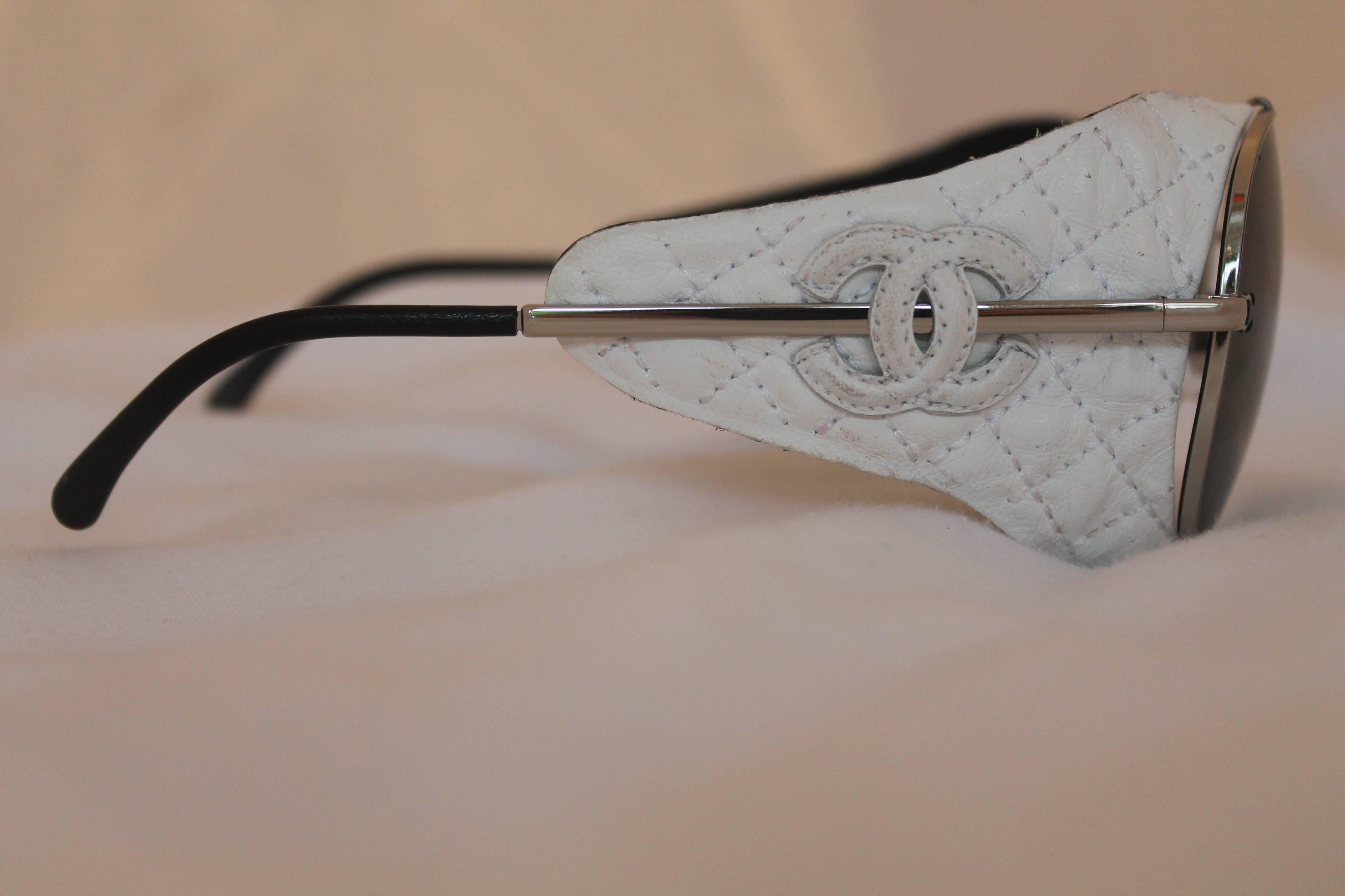 Chanel Silver Aviator with White Quilted Leather Detachable Side Piece. These sunglasses are great for the summer! They are silver aviators with the word 