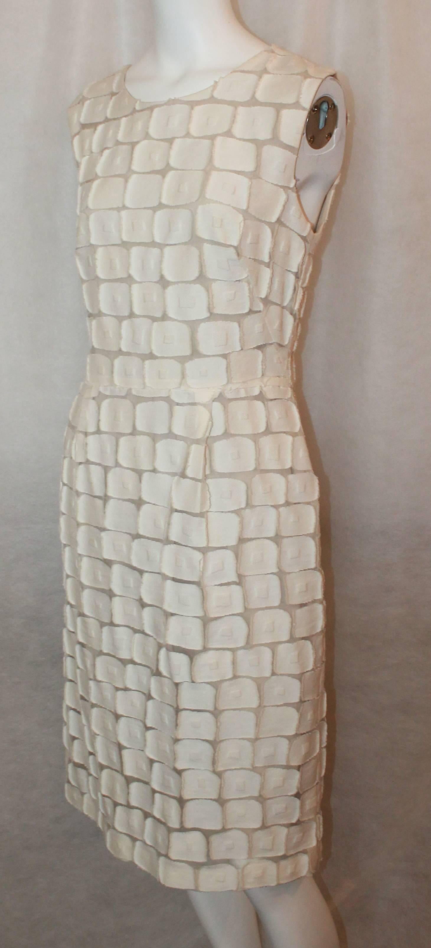 Lela Rose Ivory Cotton Blend Sleeveless Patchwork Dress - 8. This fitted dress is in excellent condition and has a unique look. The patchwork is comprised of squares and the piece has front pleats. The dress has a back