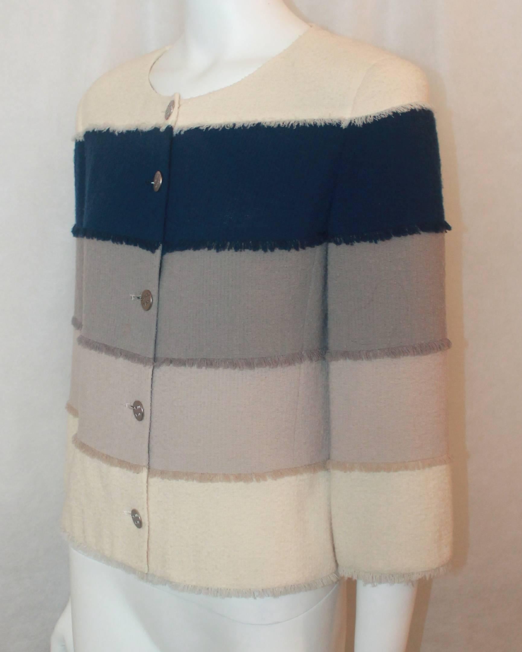 Chanel Earthtone & Blue Wool Blend Colorblock Jacket - 40 - 00C. This jacket is in very good condition with one very, very slight stain in the front in image 6. It features thick horizontal stripes with a small fringe on the bottom, silver 
