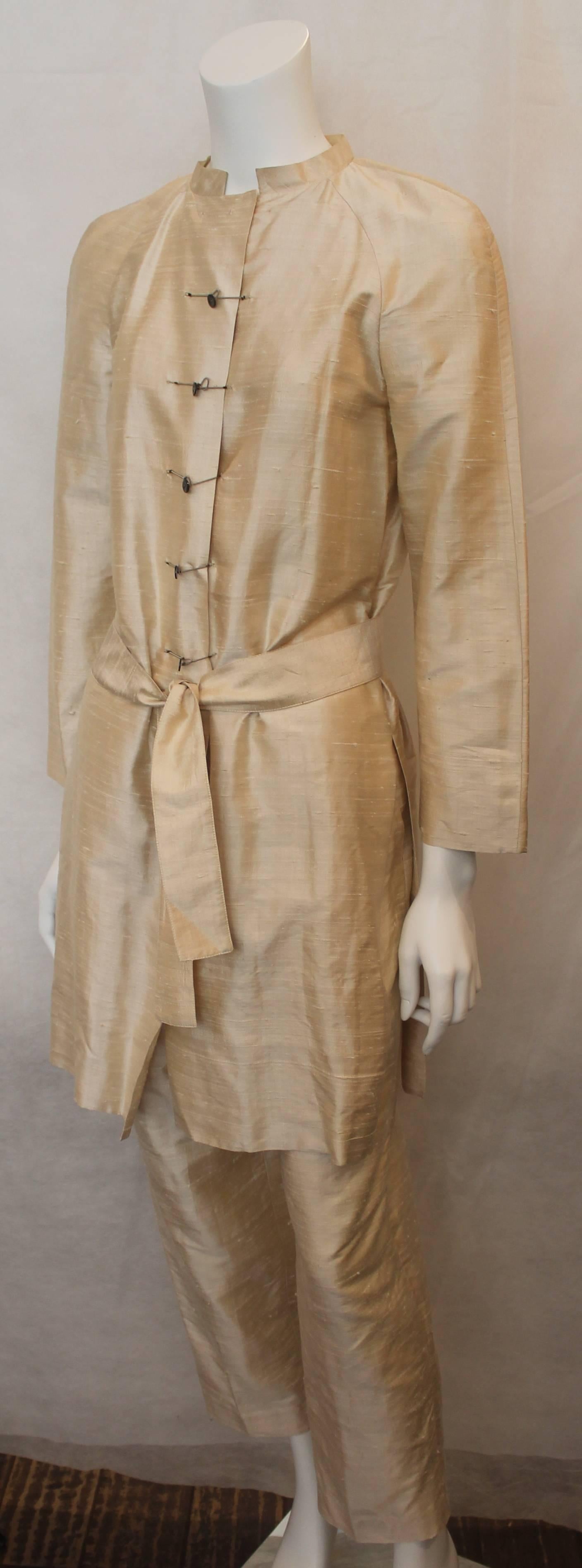 Krizia Ivory Raw Silk Coat & Pant Set with Belt - 42 - 1970's. This set is in very good vintage condition with a couple small stains on the back of the coat and some pulling throughout both pieces. The tunic features an Asian inspired look with