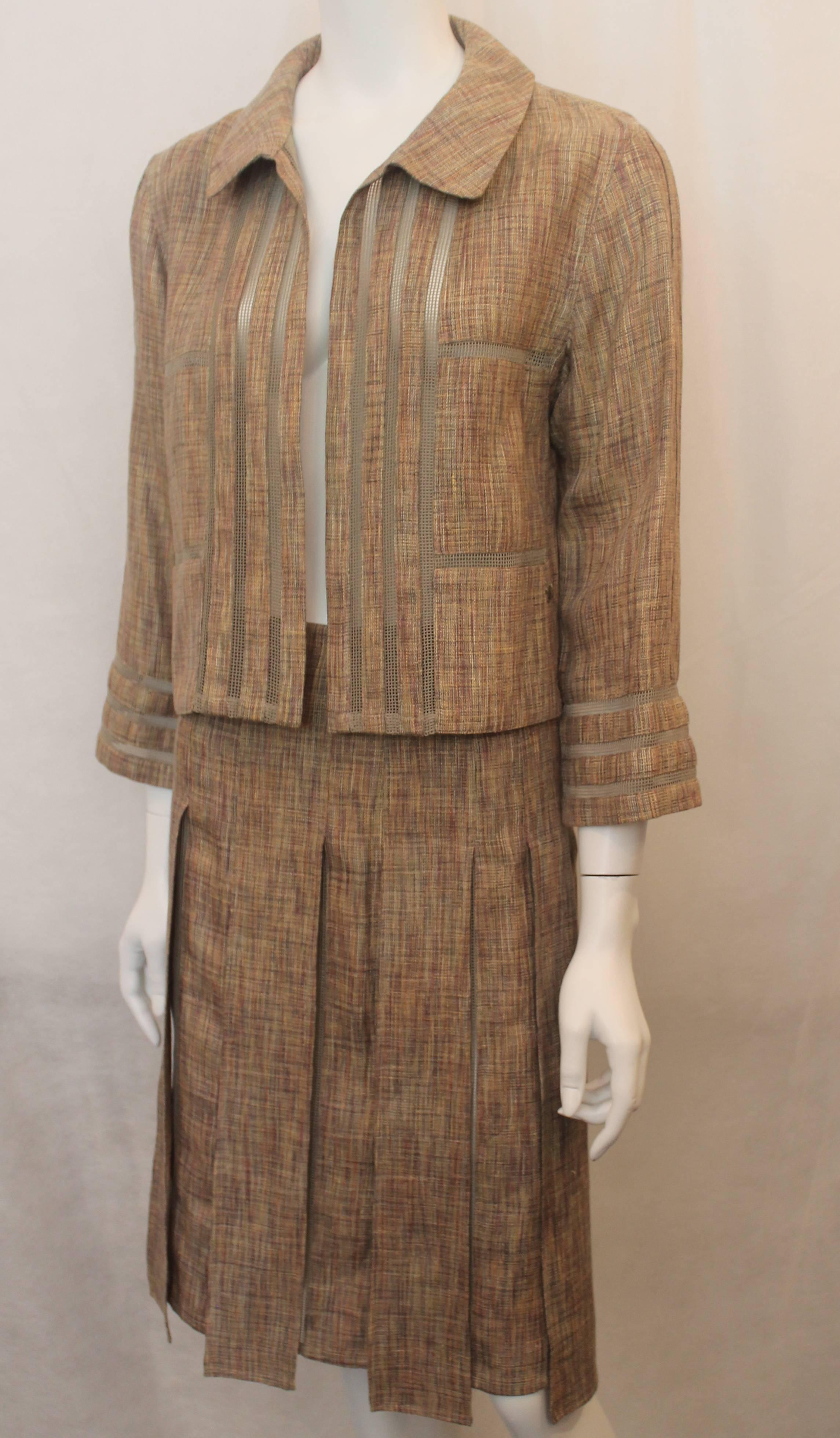 Chanel Earthtone Linen Blend Skirt Suit with Mesh Detail - 38 - 99P. This set is in excellent condition and has a very unique look. The fabric is a mixture of tan, pink, olive, and grey stitched fabric with mesh olive stripes. The collared jacket