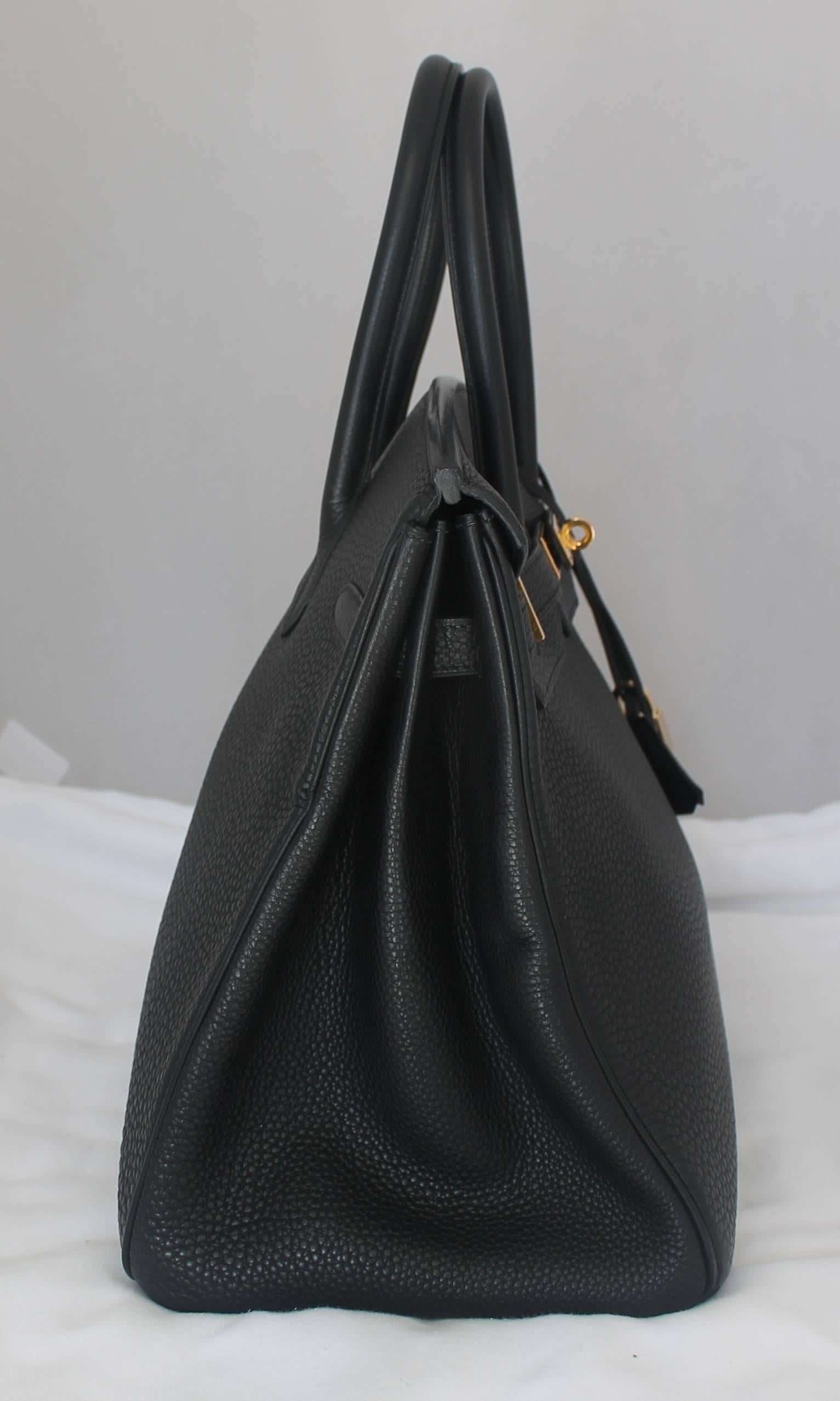 Hermes Black Togo 35 cm Birkin with Box, Duster, Rainpouch - GHW - 2002. This bag is in good condition with the only issue being scratching on the hardware, specifically on the front closure and feet. Besides that, the leather is in excellent