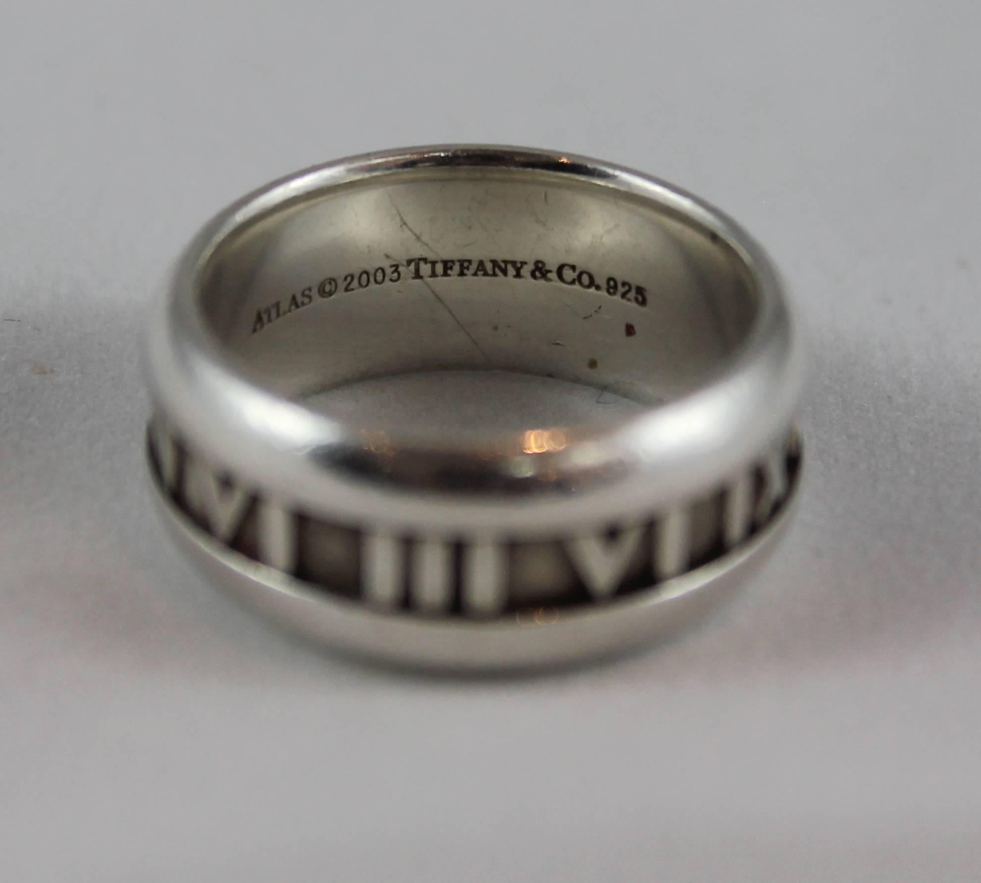 Tiffany & Co. Sterling Silver Atlas Ring - 9 - 2003. This ring is in very good condition with some wear consisting of darkening between the Roman numerals. The ring is a size 9 and there is a matching thing Atlas cuff available.

Width- 0.4