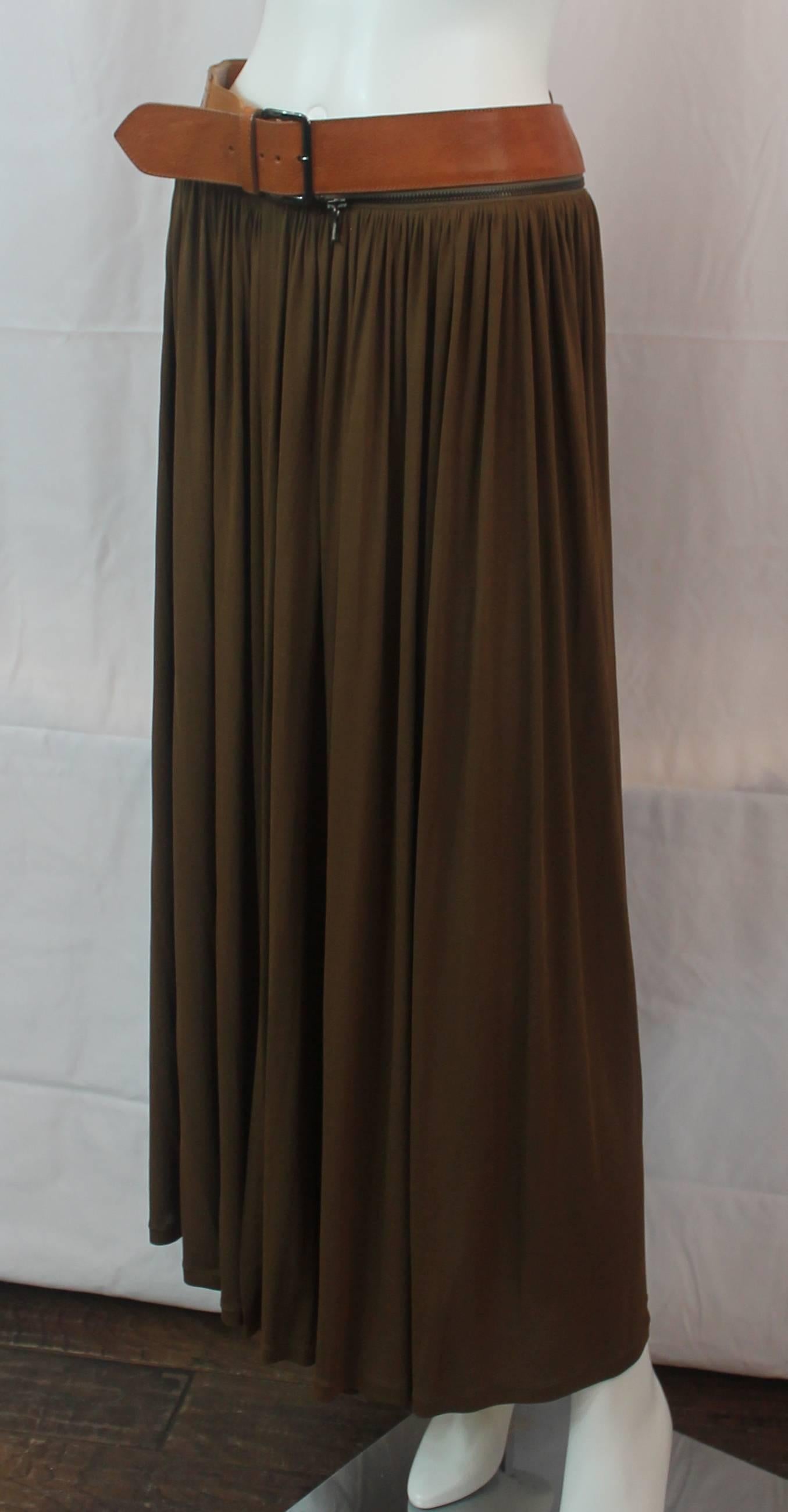 Jean Paul Gaultier Brown Jersey Maxi Wrap Skirt with Luggage Leather Belt - 8. This maxi wrap skirt is a brown jersey material and has a luggage leather belt at the waist. The belt has a zipper attached to it, making it removable.The skirt is in