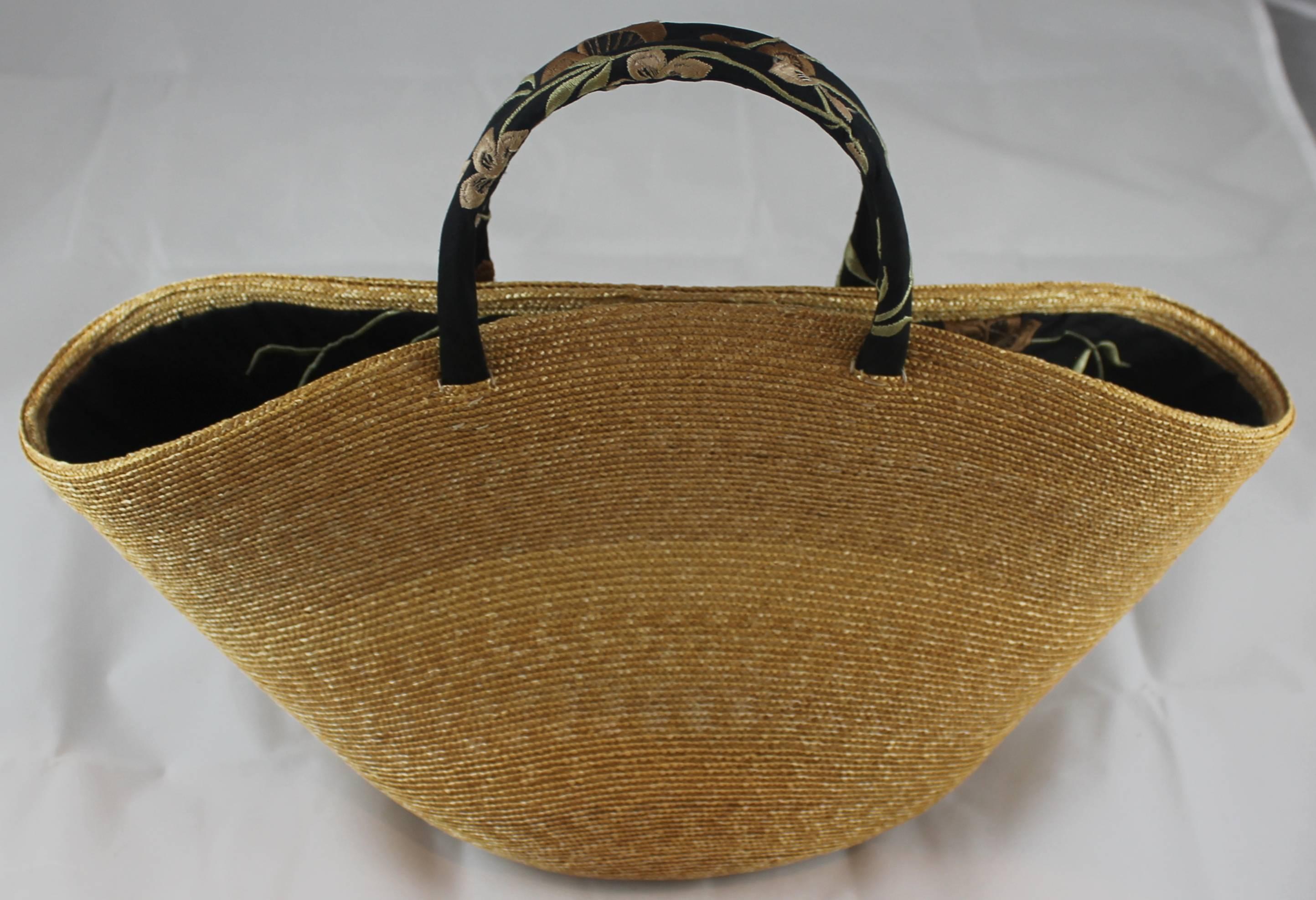 Suzanne Couture Millinery Small Tan Woven Straw Bag with Floral Handles. This cute woven straw bag is a tan color and has handles and matching lining that is black silk with a colored floral print. It is in excellent condition. There is a matching