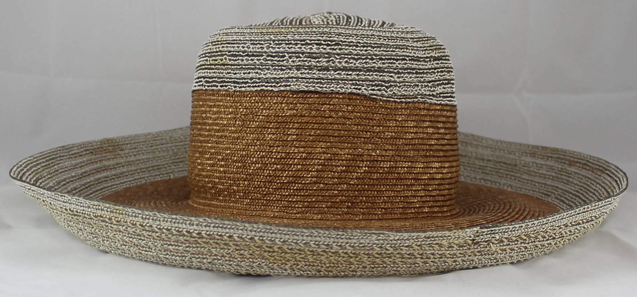 Suzanne Couture Millinery Ivory and Beige Straw Hat. This cute hat is great for the summer!  It is ivory with a thick beige band in the middle. It is in good condition with faint staining (see pictures).

Measurements:
Brim: 4