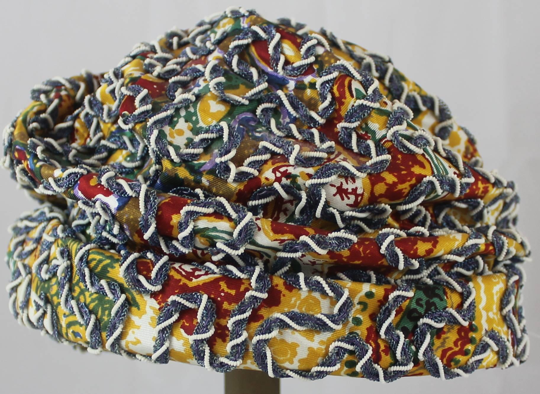 Strawbridge & Clothier Vintage Multicolor Ruched Embroidered Hat - 1960's. This hat is in very good vintage condition with some threads and beading starting to come loose. It has a yellow and multicolor printed background with purple, blue, and