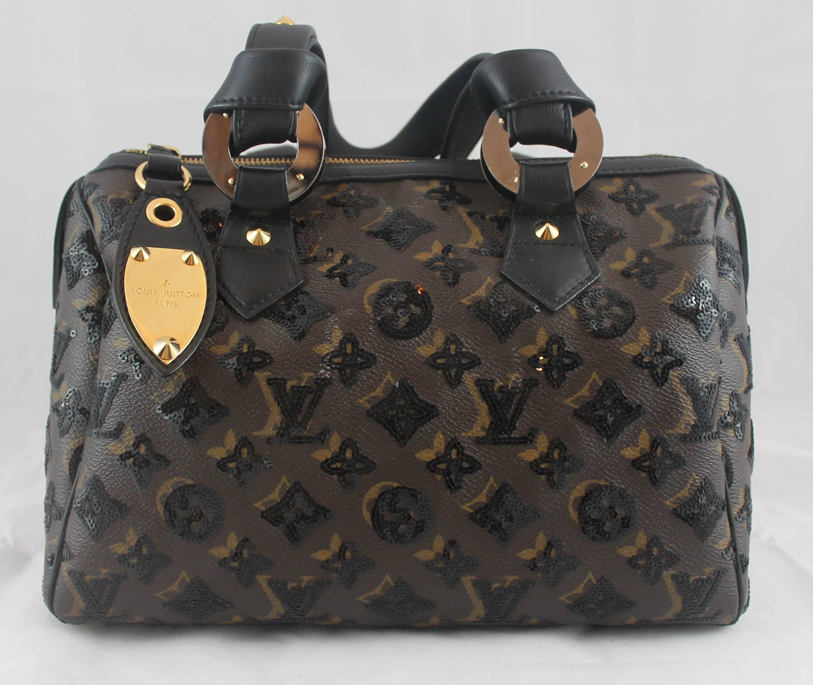 Louis Vuitton Limited Edition Monogram Eclipse Speedy Noir Bag - 2009. This bag is new with tags and comes with a duster. The unique bag features the classic LV monogram print with black sequins, black leather trim, feet on the bottom, a Louis