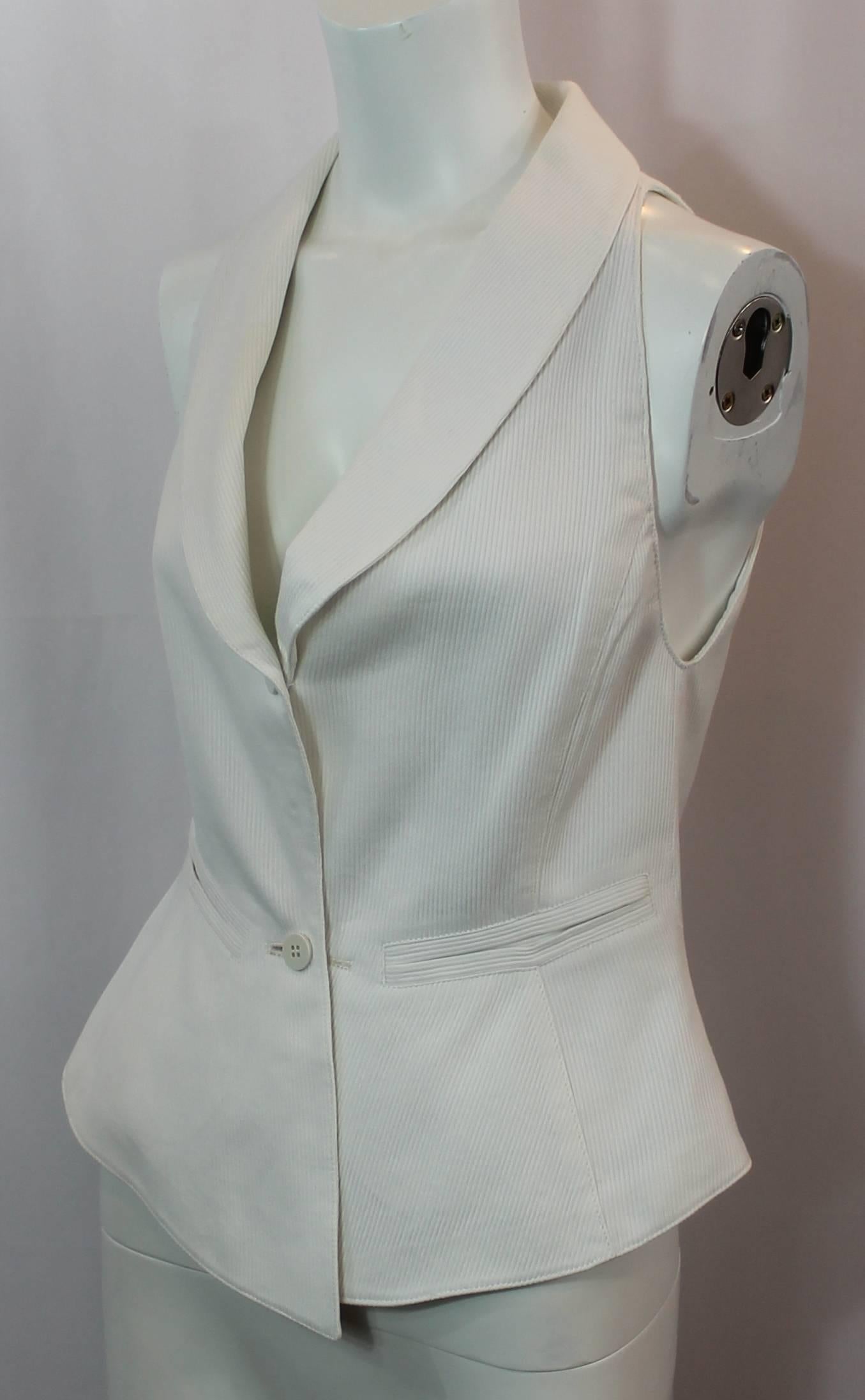 Claude Montana White Cotton Tuxedo Style Vest - S - 1980's. This vest is in excellent vintage condition with minor wear consistent with its age; mainly that some threads are starting to loosen on the edges of the garment. The vest features a ribbed