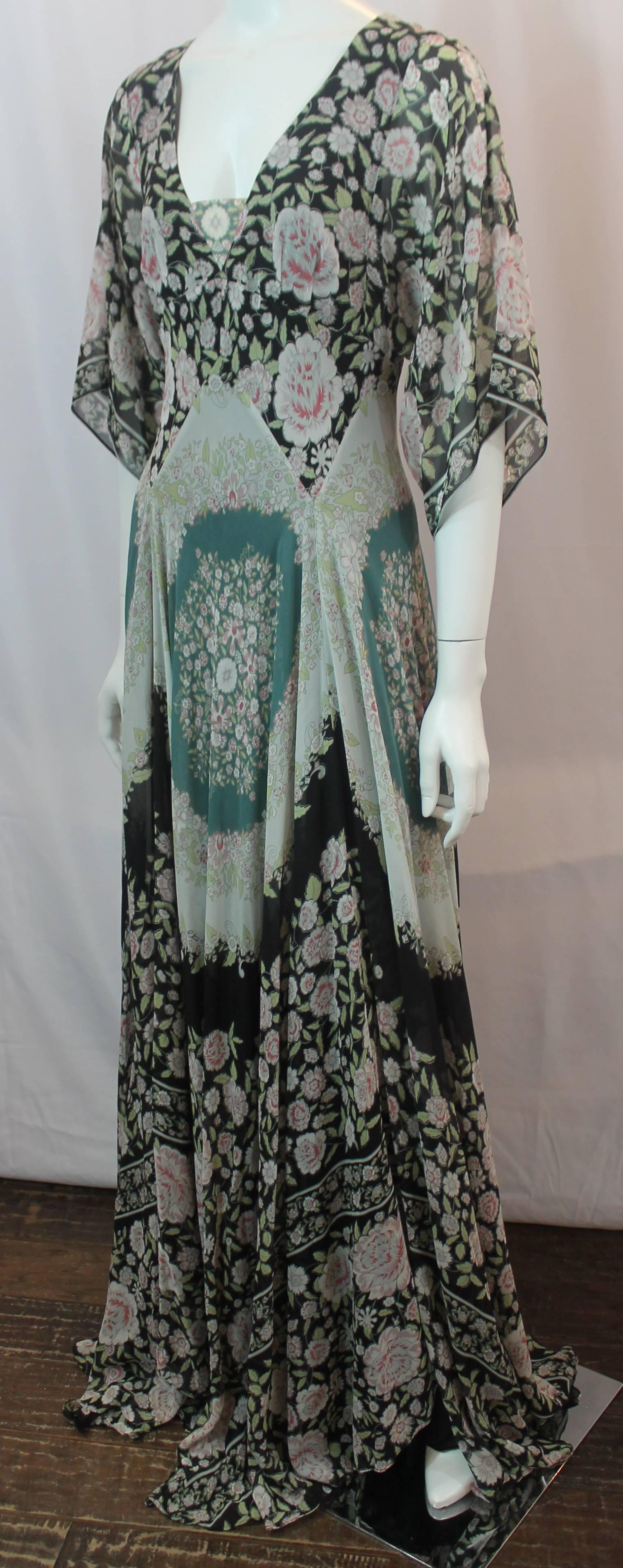 Etro Multi-Color Printed Silk Chiffon Peasant Style Gown - 44. This gown can double as a maxi dress and is floral printed with different colors such as black, light pink, and green. It has a peasant style and has elbow length sleeves, a back zipper,
