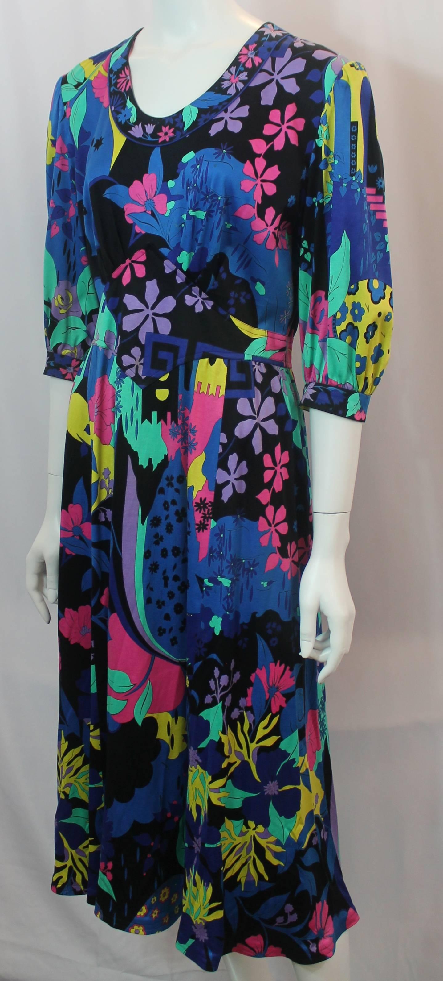Averardo Bessi Vintage Multi-Colored Floral Dress - 12 - circa 1960's-1970's. This unique dress is floral printed in bold colors. It has elbow-length sleeves and a zipper in the back. It is in fair vintage condition with stains consistent with age