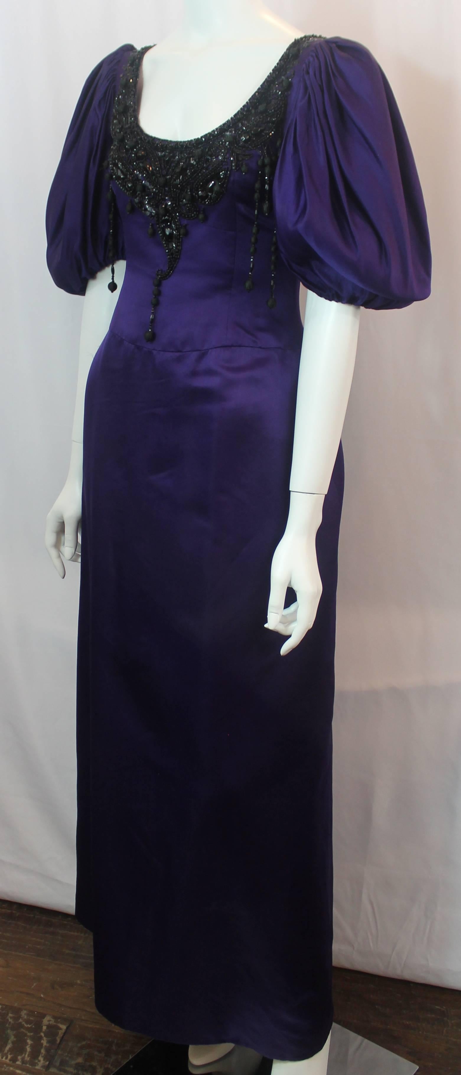 Oscar de la Renta Purple Silk Gown with Puffy Sleeves and Beading - 8 -circa 90s. This ball gown has a swoop neckline and puffy sleeves. It is purple silk decorated with black beading and hanging beads. There is a back zipper.