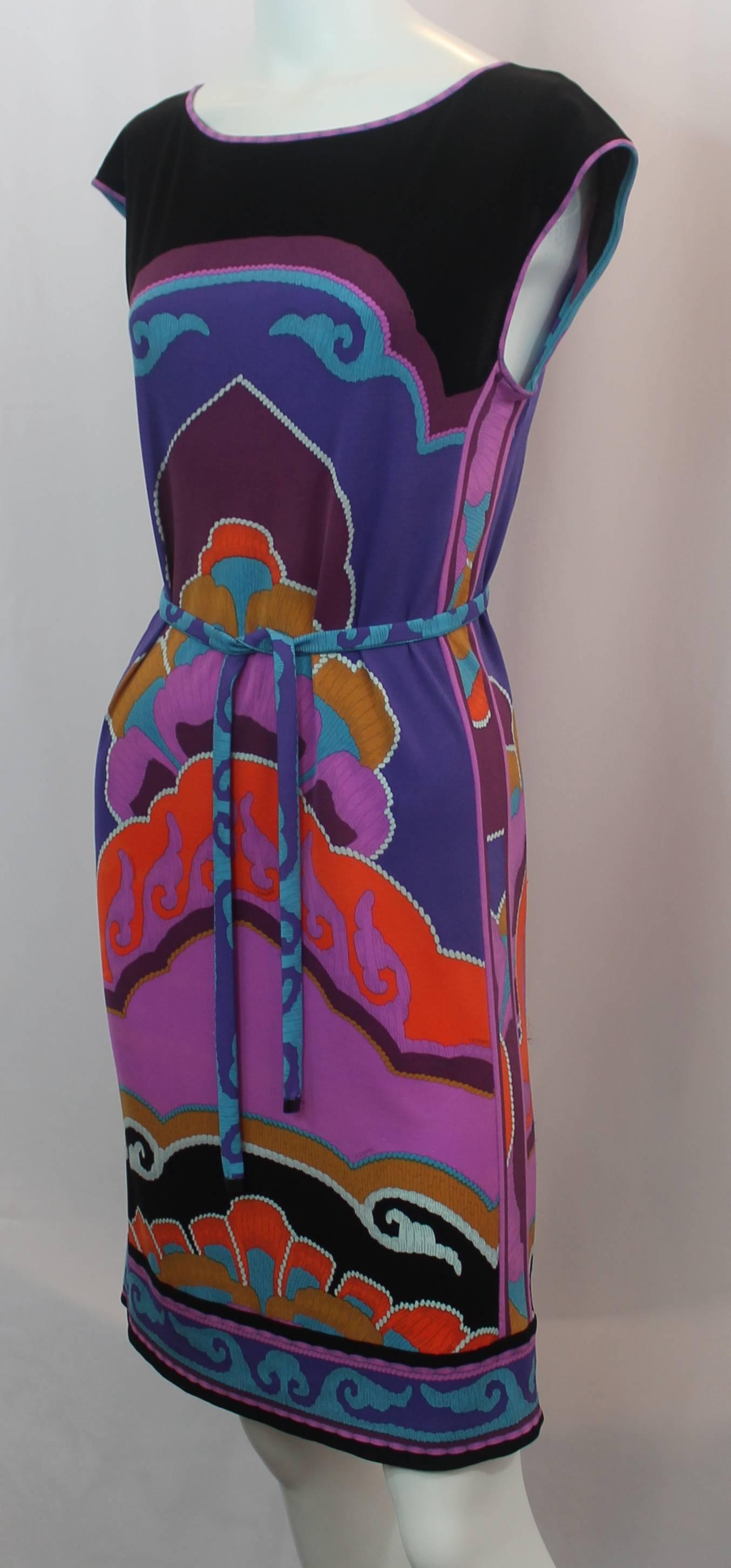 Leonard Multi-Colored Silk Jersey Moroccan Print Sleeveless Dress - 36. This fun dress is sleeveless with a tie belt. It has a slight shift shape to it and has a large Moroccan print in black, purples, blues, and oranges. It is in fair condition