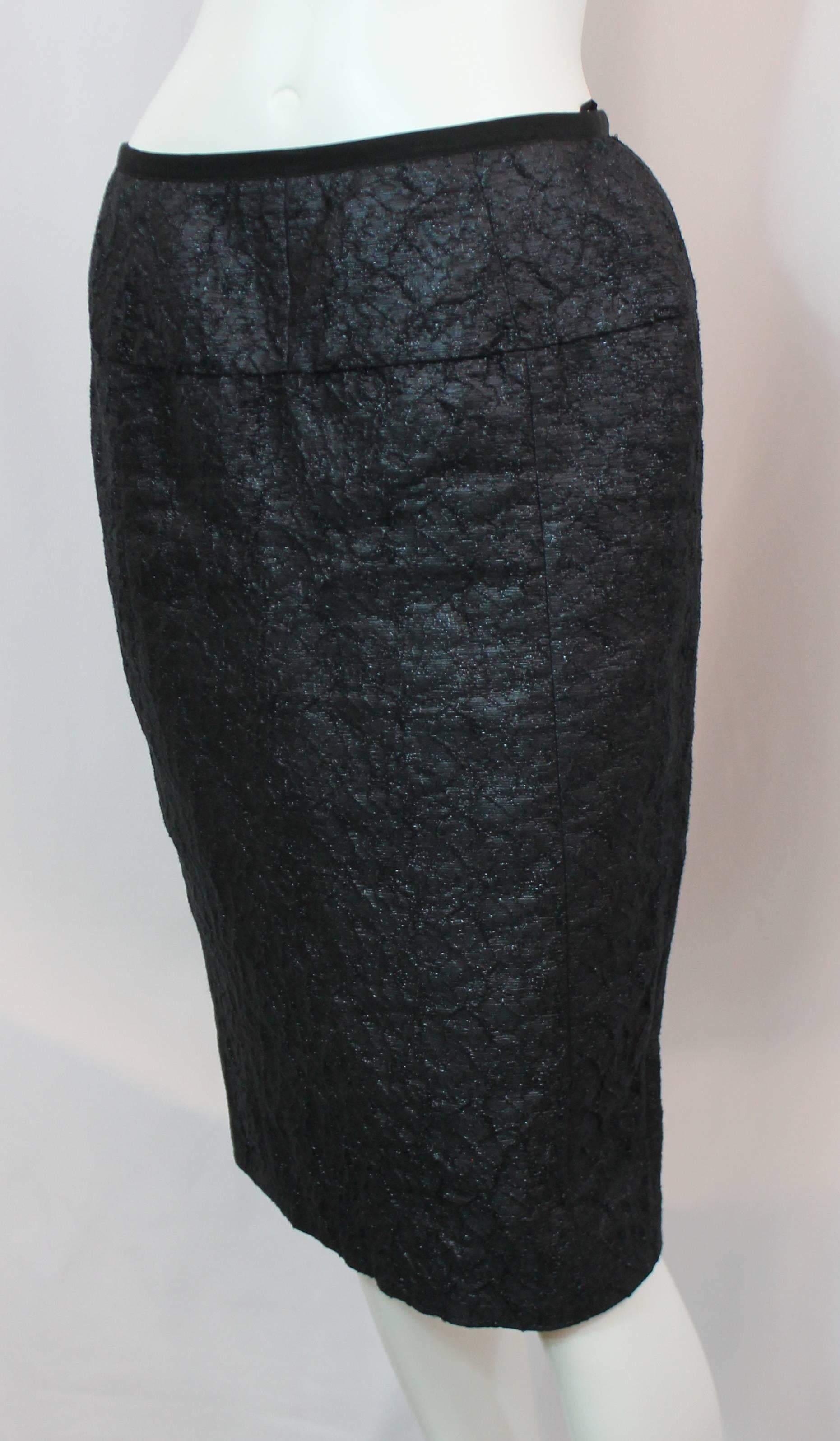 Nina Ricci Dark Navy Linen with Metallic Sheen Blend Brocade Skirt - 40. This dark navy skirt is made of a linen-silk blend. It is scrunched brocade with black ribbon all along the waist. The zipper is in the back and it is in excellent