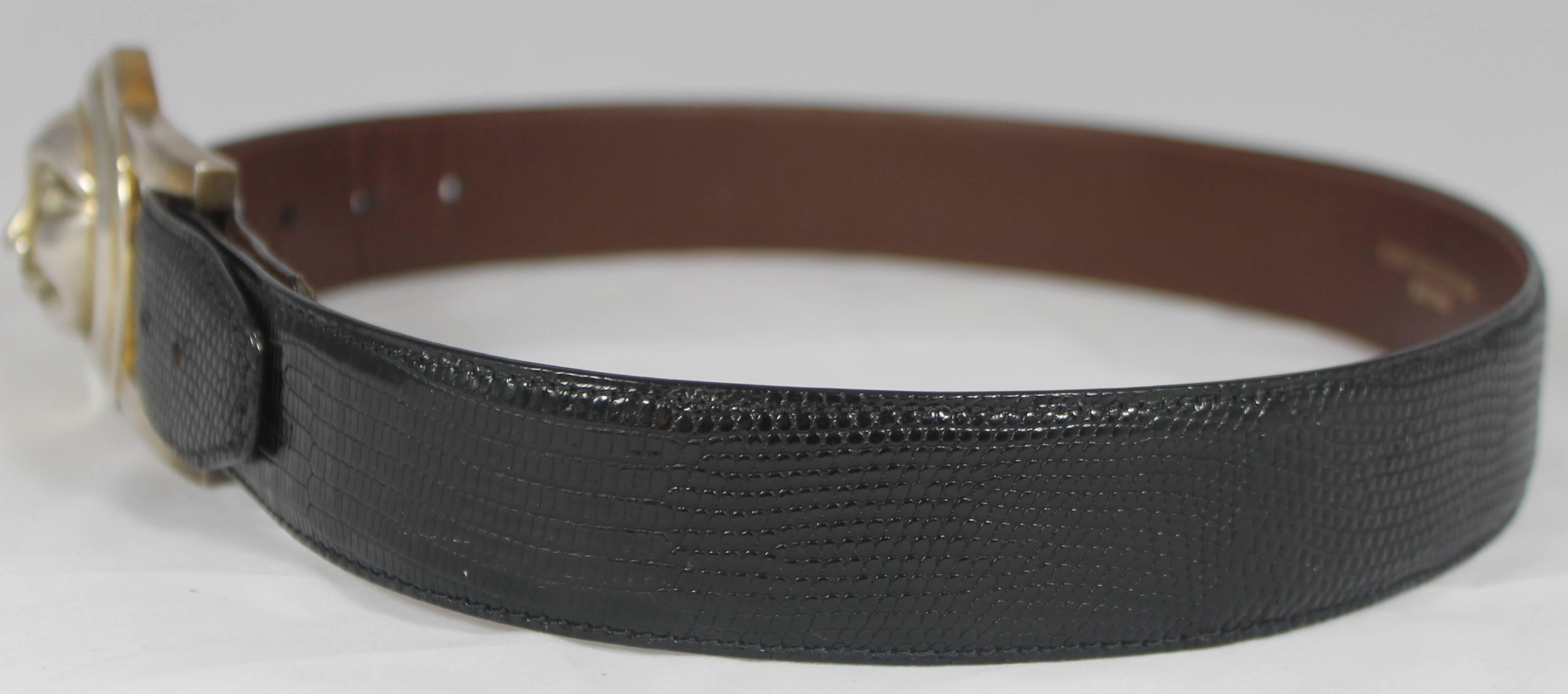 Barry Kieselstein-Cord Black Lizard Belt with Sun/Moon Buckle. This beautiful belt is genuine lizard and has a silver buckle that is half moon and half sun and has a face. This belt is in very good condition with some discoloration on the