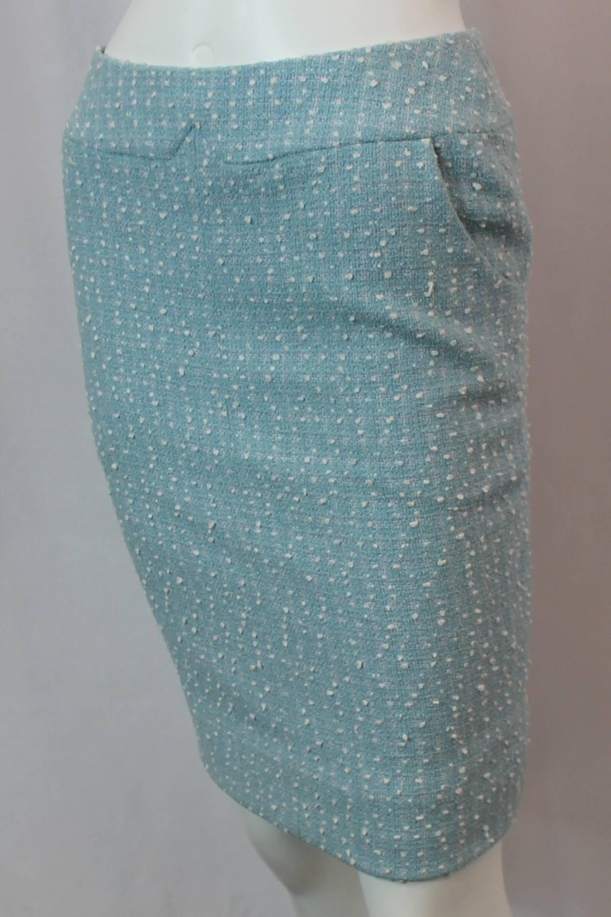 Chanel Light Blue Tweed Tapered Wool Blend Skirt - 38 - 1900's. This beautiful skirt is a light blue color with white balls of string on the tweed. It is made of a wool / cotton / nylon blend. There are 2 front pockets and a tapered structure. A