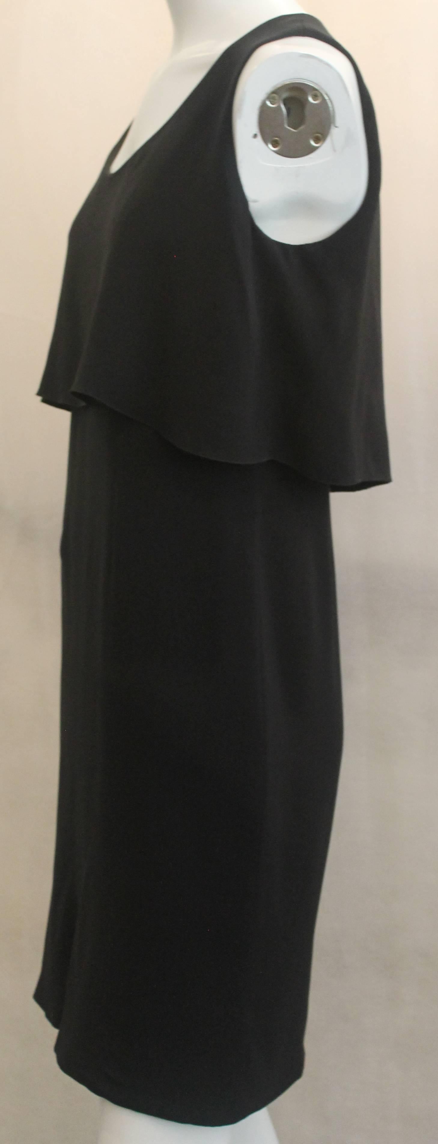 Chanel Black Silk Sleeveless Dress - 36 - 07A. This classic dress is has a flowing style with the upper portion near the bodice having one piece of hanging fabric. It is in excellent condition.

Measurements

Bust: 36