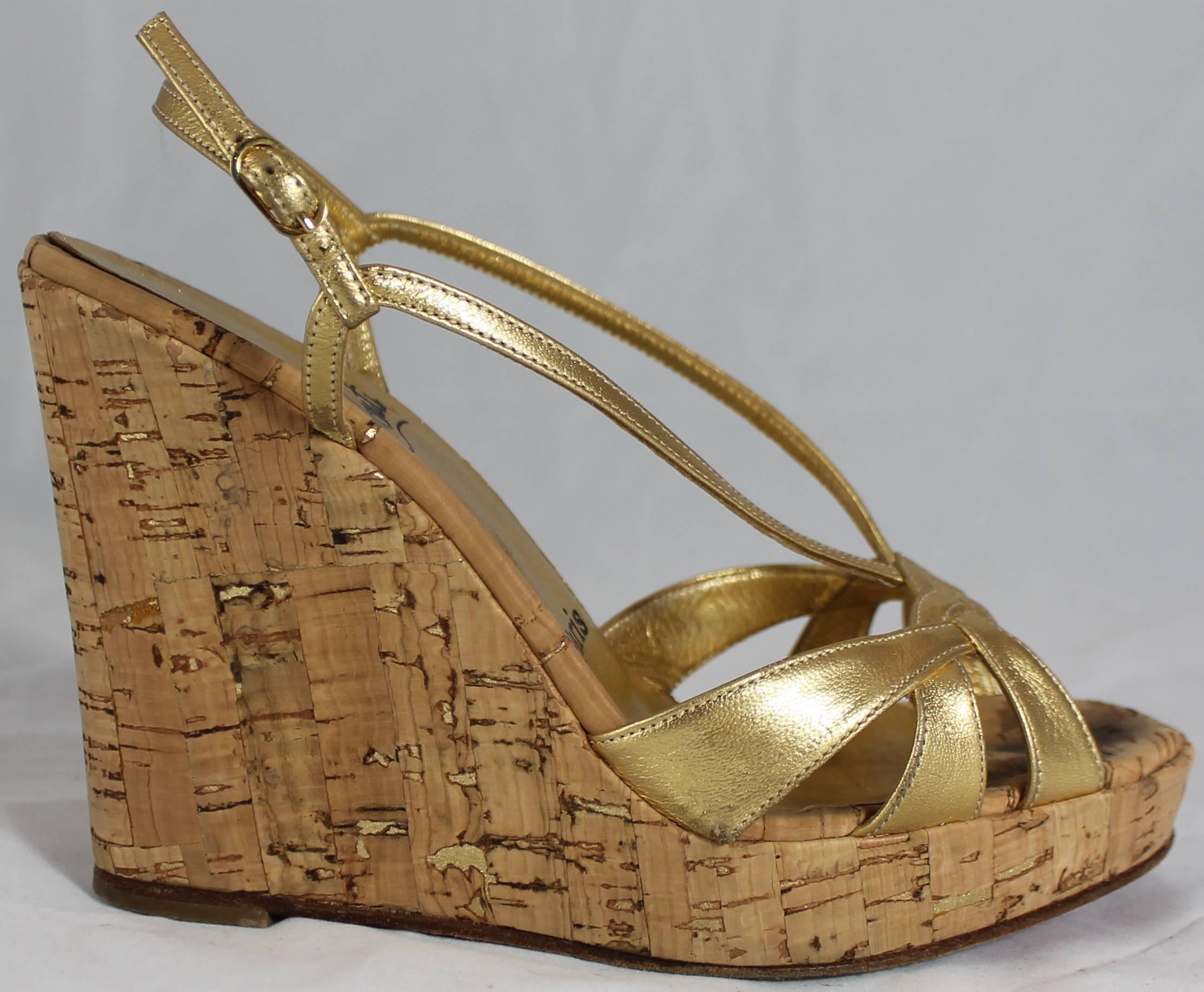 Christian Louboutin Gold Leather Strappy Cork Wedges - 36. These beautiful wedges have a strappy front in a metallic gold. The wedge is tan with gold flakes mixed in. They are in very good condition with some bottom wear and minor dirt marks on the