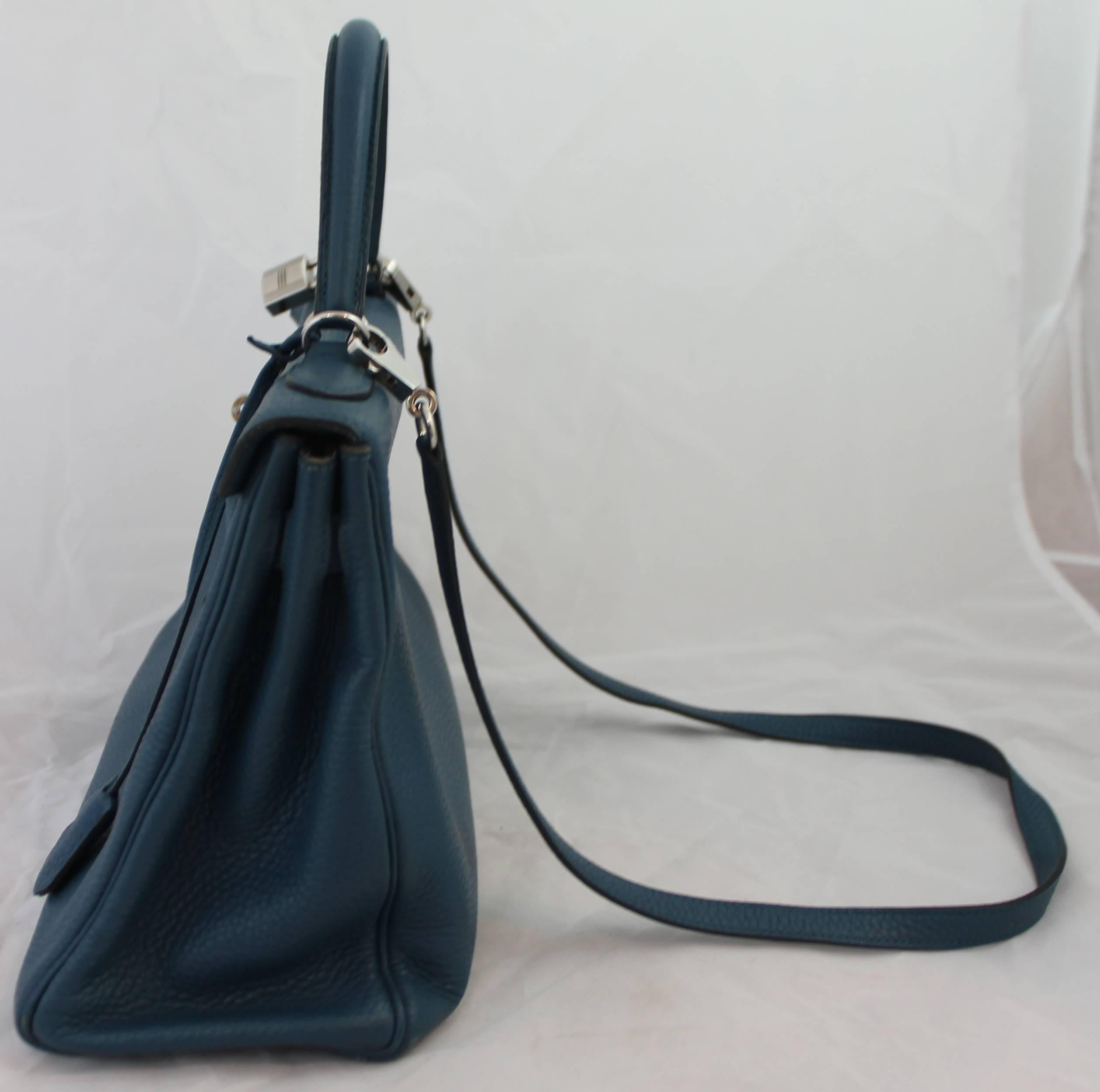 Hermes Blue Thalassa Togo 32cm Retourne Kelly Handbag - PHW- 2013 This beautiful Kelly Handbag is in the soft togo called the retourne style. The bag is in very good condition with the exception of some wear on the bottom corners of the bag, visible