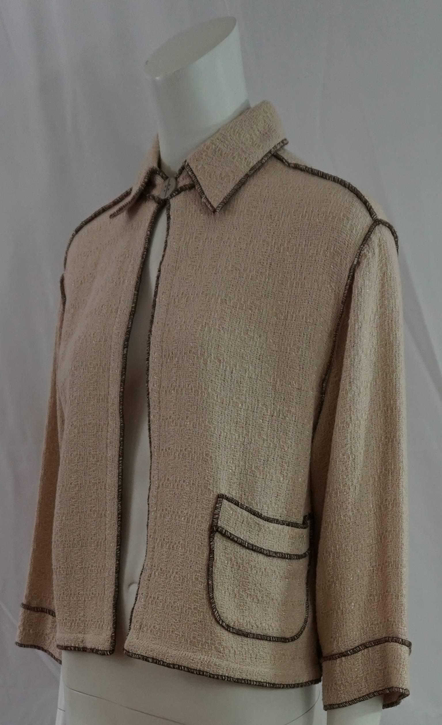 Chanel Runway Spring 1999 Collection Oatmeal Cotton Knit Jacket with Brown stitching - Size 38. This beautiful oatmeal/beige cotton knit blend lightweight box style/semi crop jacket has a 3/4 sleeve and a drop shoulder. It has one top silver tone