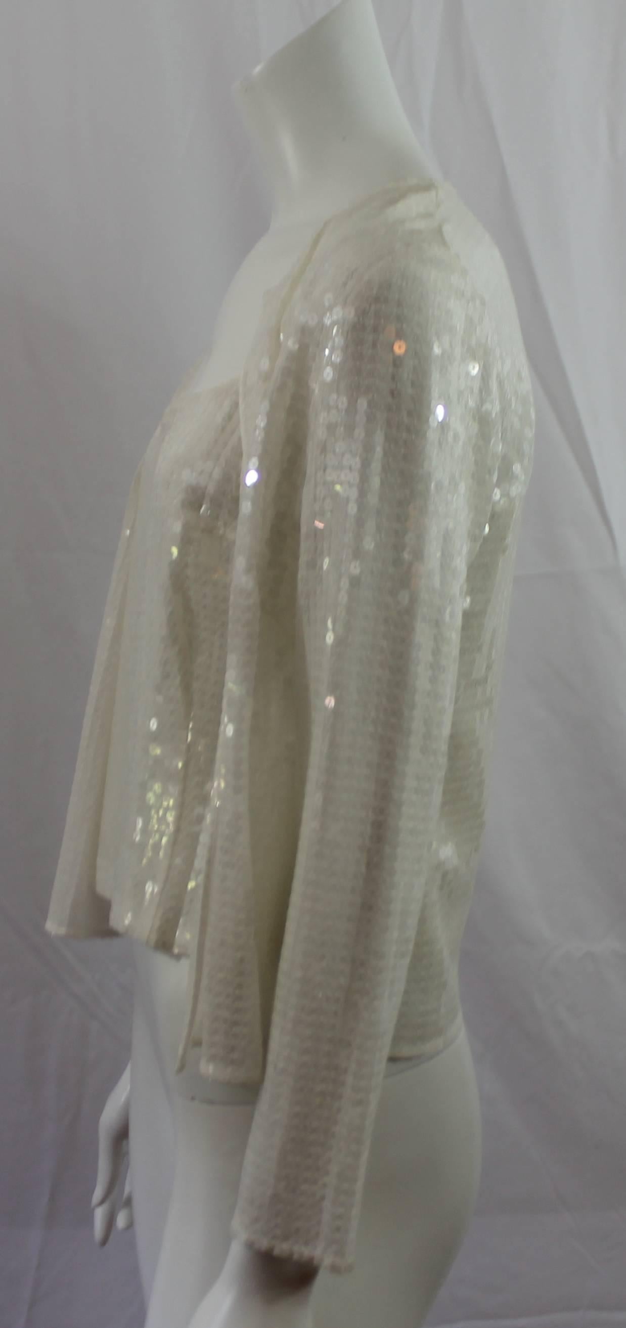 Akris Punto White Silk & Sequin 2 pc Cami and Jacket - 8  This beautiful set is a perfect piece for a summer evening out. Cami has side zipper. This item is in excellent condition.
Measurements:
Cami:  Bust 36