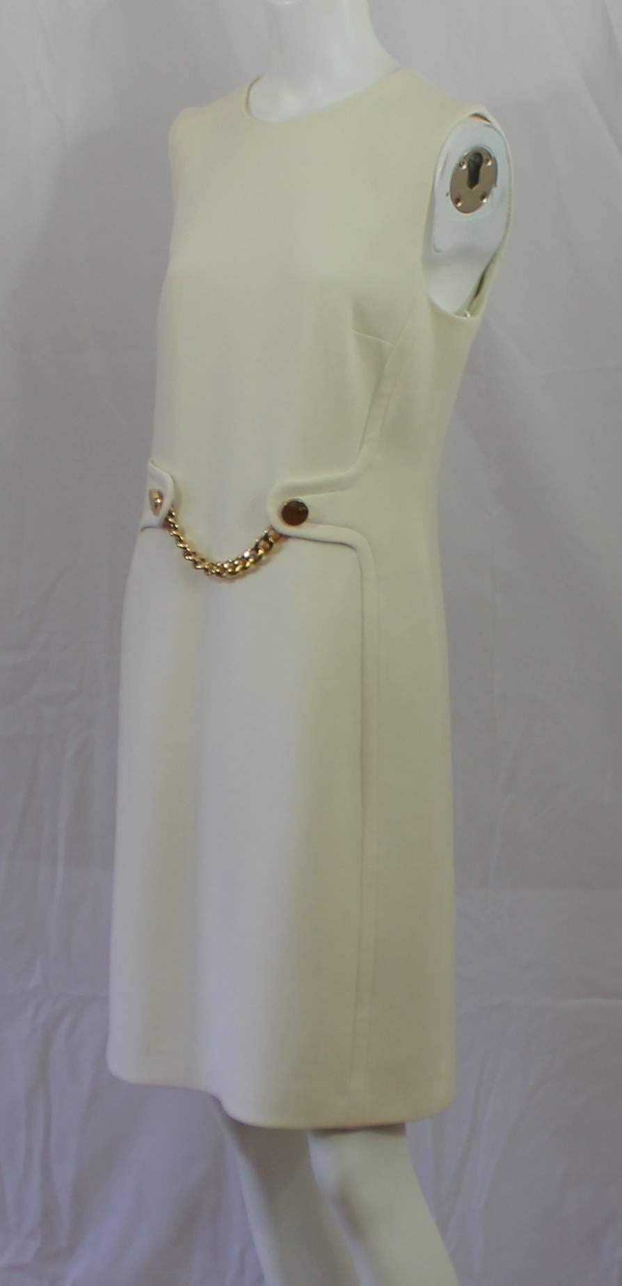 Michael Kors Ivory Lightweight Wool Sleeveless Shift Dress - GHW-10 This beautiful shift has a decorative gold chain link hanging in the front waist section, back zipper and round neckline. This dress is in excellent condition.
Measurements:
Bust