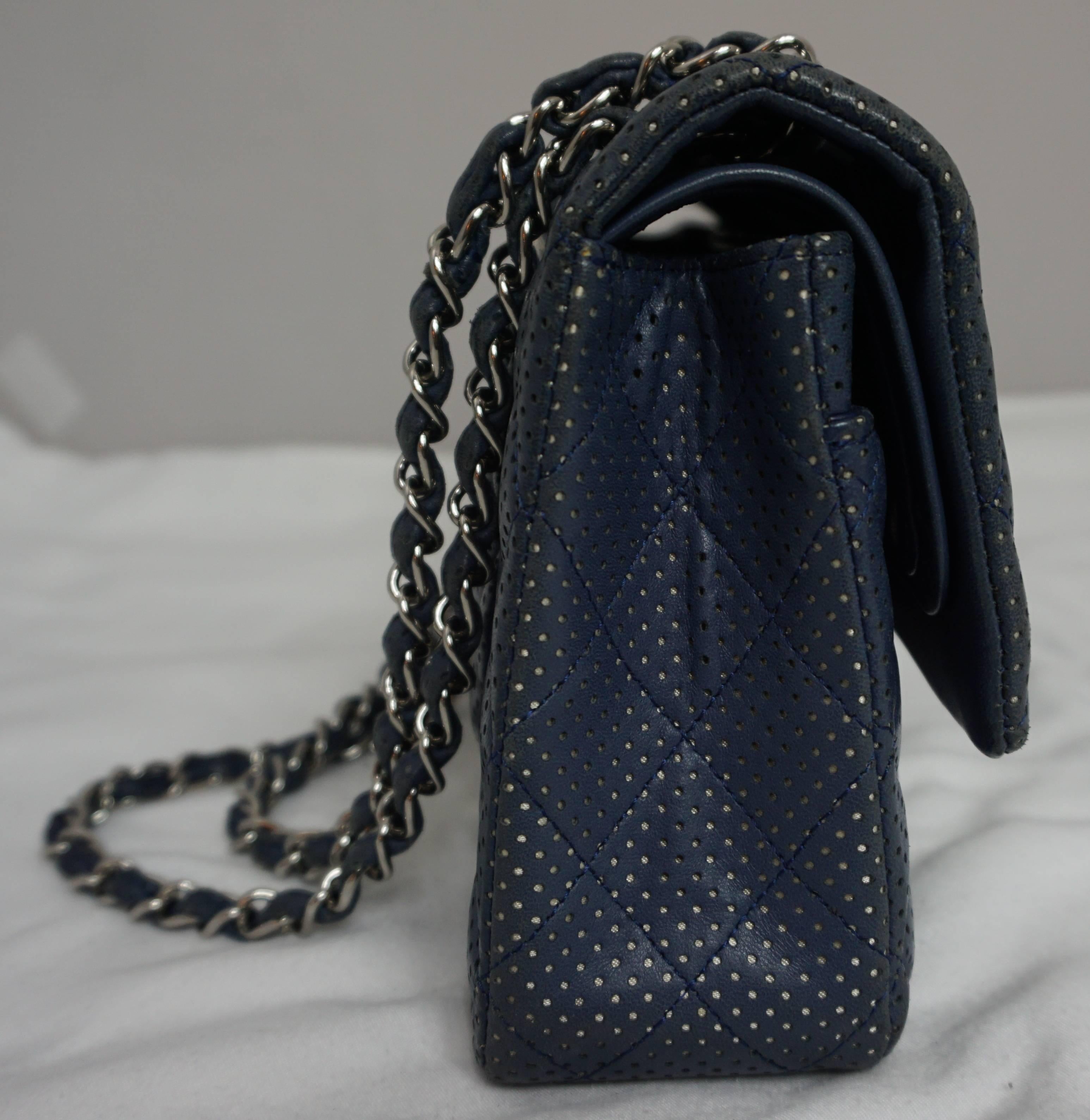 Chanel Blue/Silver Perforated Leather Medium Double Flap Handbag-SHW-2006 This beautiful and unique combination is a light navy blue perforated leather with silver coming through the perforations, It is a medium double flap and has SHW and the