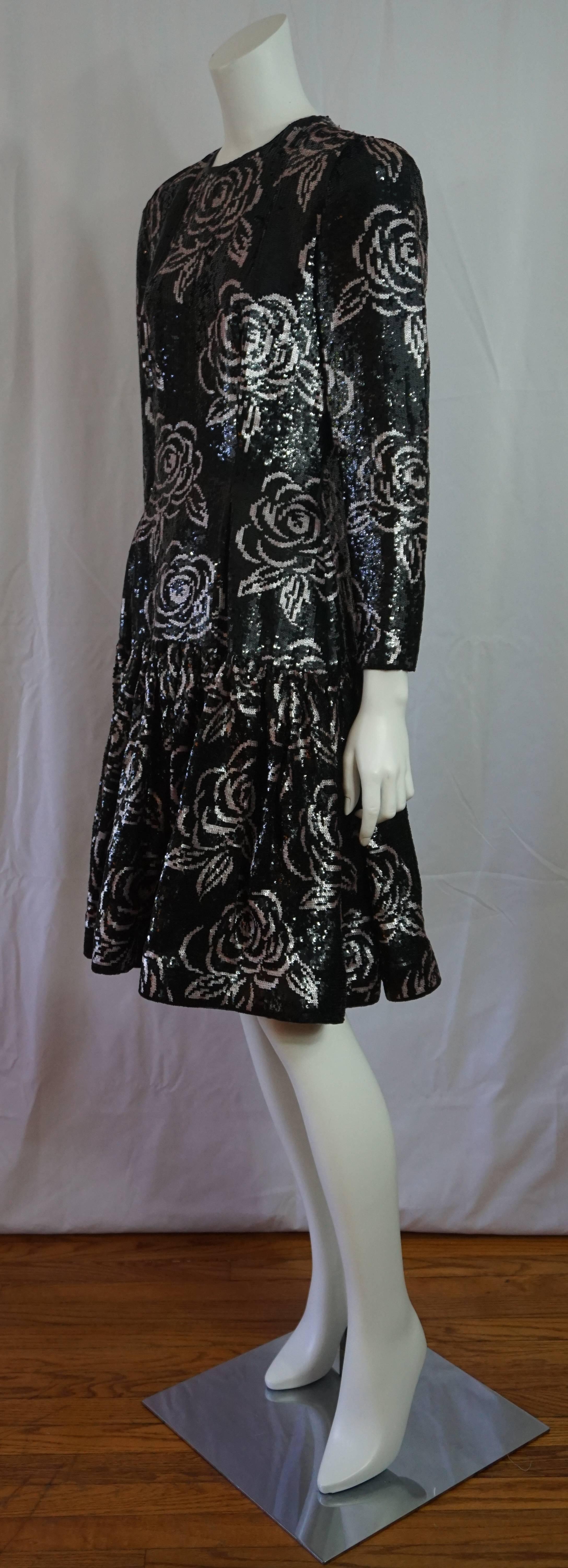 Oscar de la Renta Black and Silver sequin cocktail dress-10-Circa 80's  This beautiful vintage Oscar cocktail dress has a round neckline, long sleeves, fitted to the lower hip where there is a full gathered skirt. It has a horse hair hem, lined in