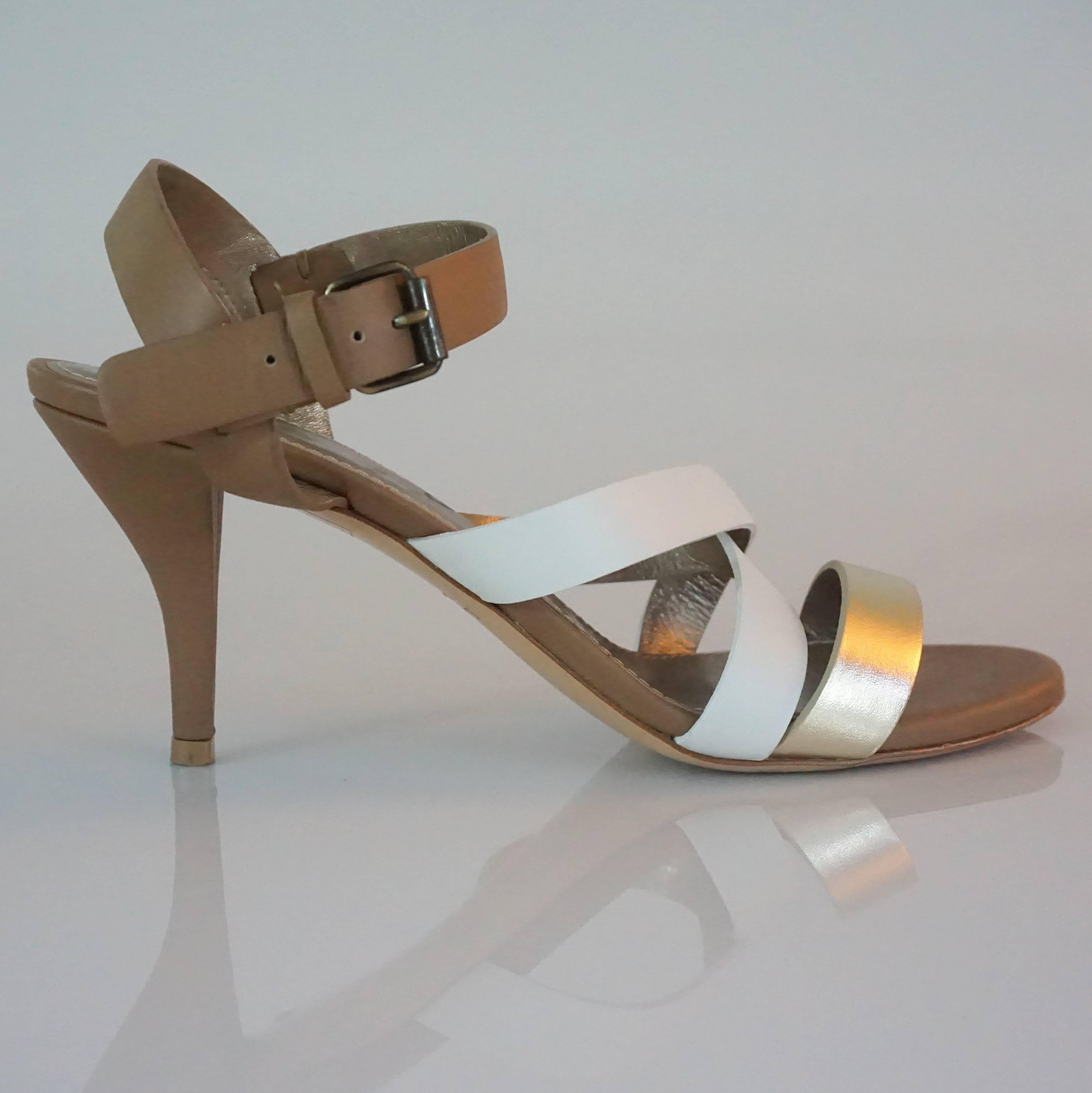Lanvin Tan/White/Gold Strappy Leather Sandal - 37  This is a great summer sandal, and is very versatile for day or night. The shoe has an ankle strap and three straps across the front, and  is in excellent condition.

Heel Height 3.25