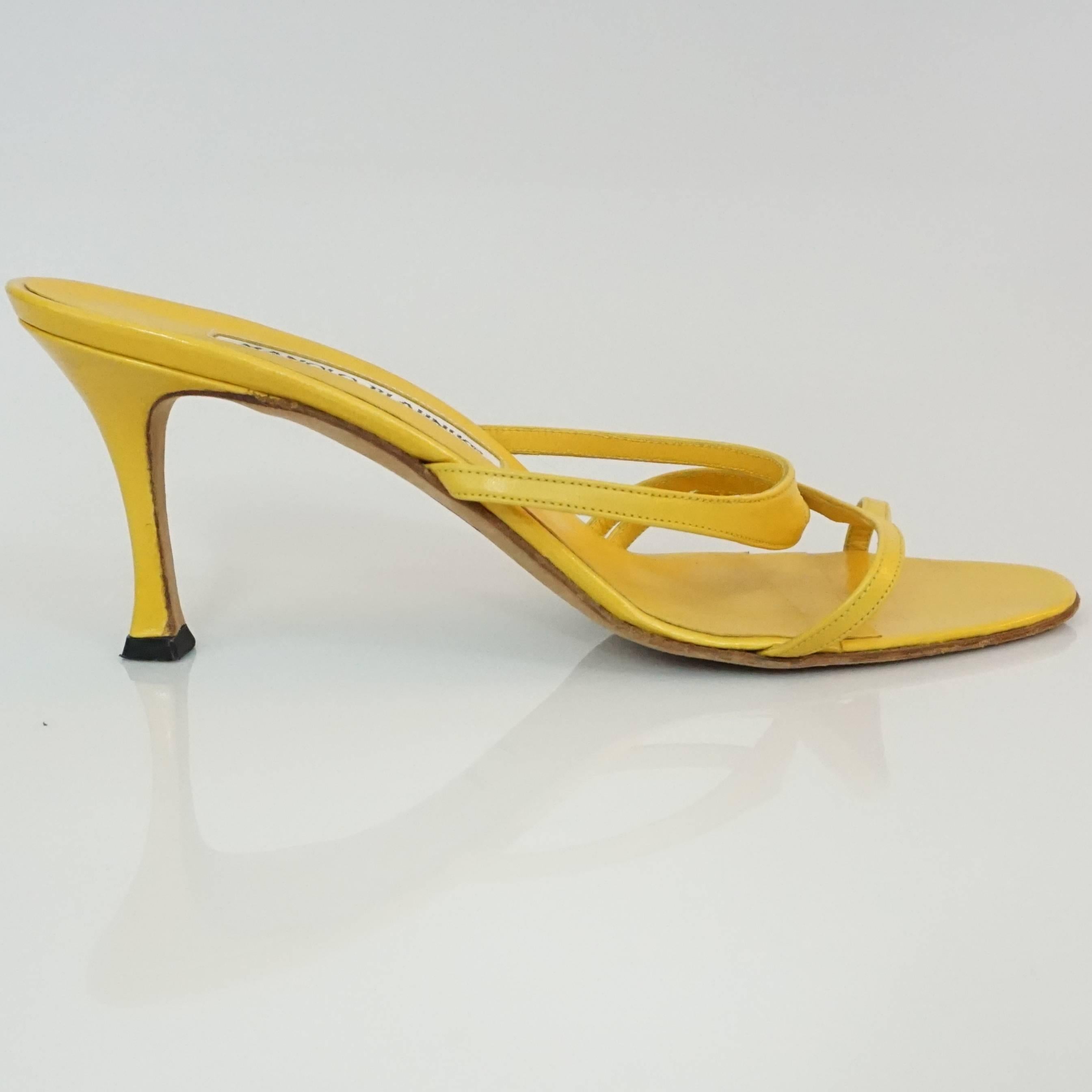 Manolo Blahnik Yellow Leather strappy sandal - 37  This beautiful sandal is the perfect pop of color for any outfit, and great for the summer. The shoe is in excellent condition. 

Heel Height 2.75