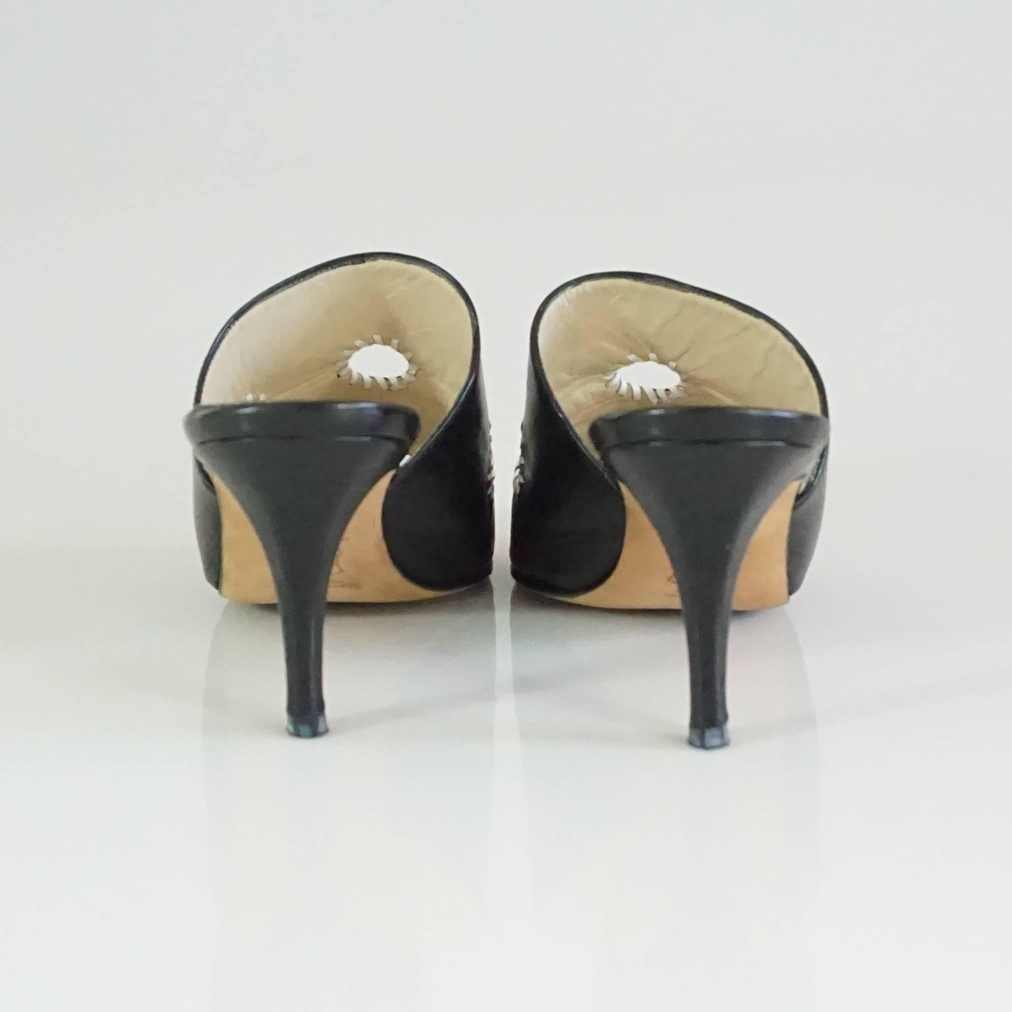 Women's Manolo Blahnik Black Leather Mules with White Stitched Cutouts - 37