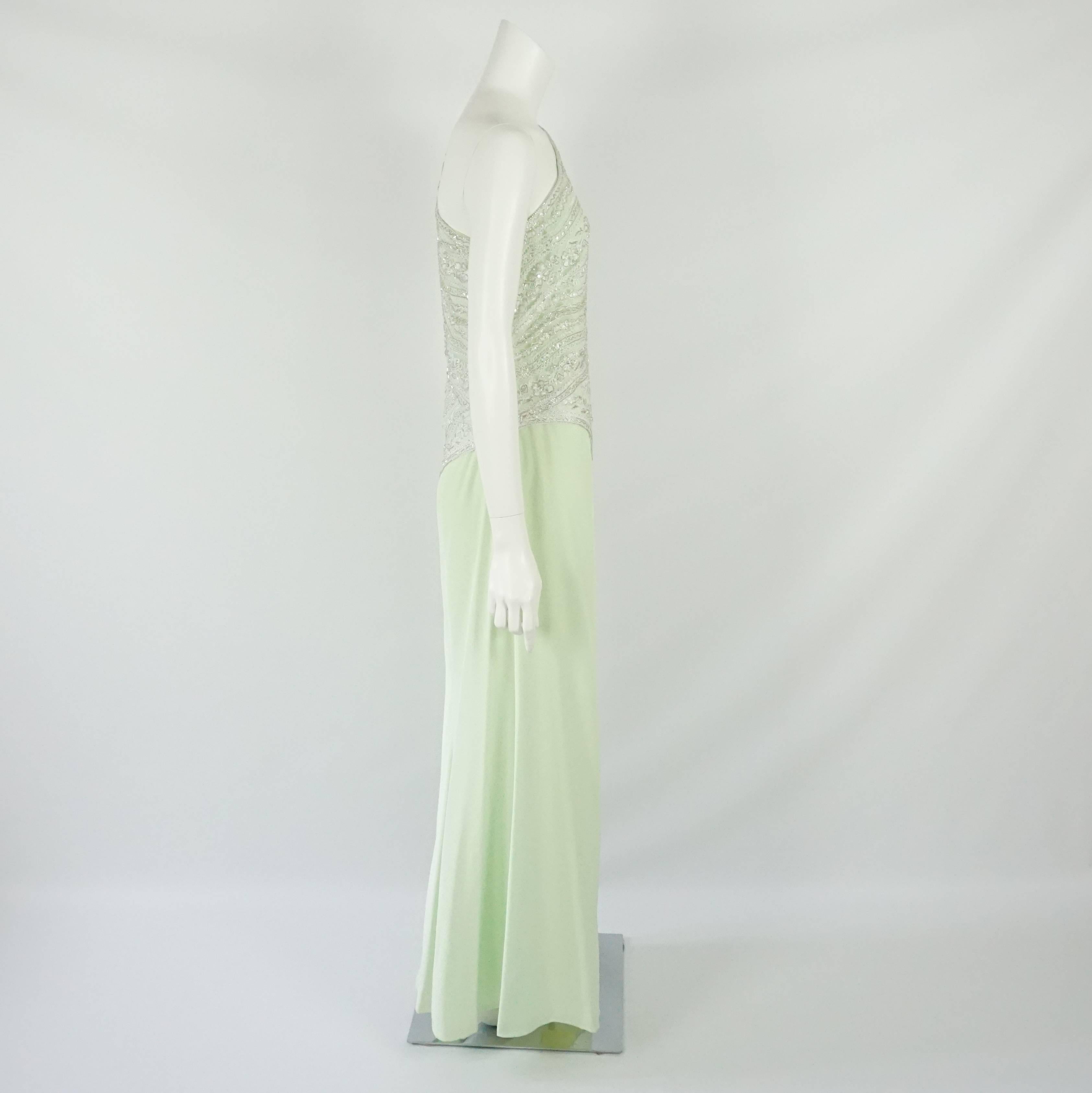 Bob Mackie Mint Silk & Lace Beaded One Shoulder Gown - 12 - 1980's. This gown is has an elegant and delicate look. It features a mint underlay fabric, loose style, and a floral lace overlay with beaded along the bodice with an asymmetrical cut. The