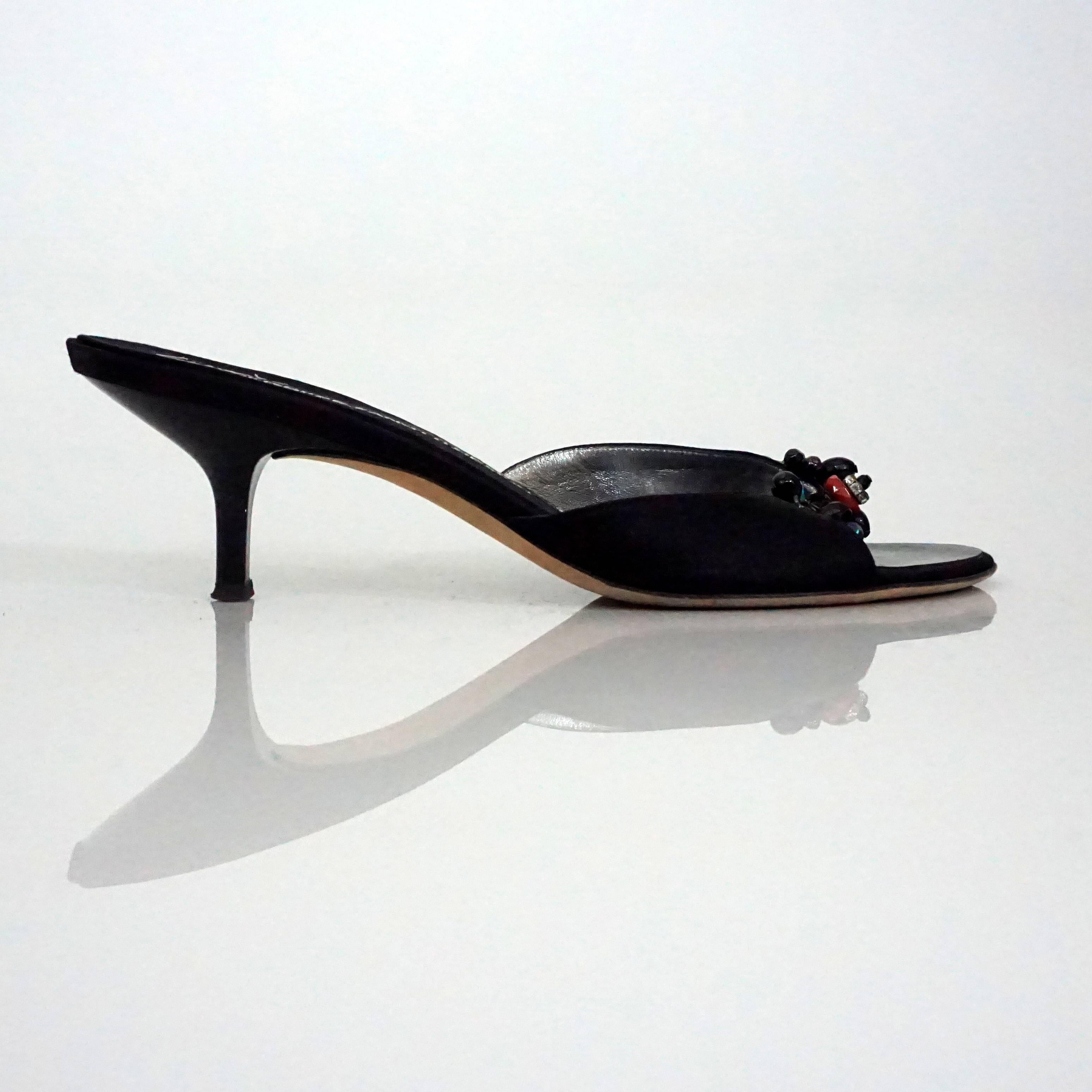 Giuseppe Zanotti Black Satin Slide with Stone Front Detail - 9.  These elegant black satin slide, with black and red stone/beads across the front of the shoe, a black enamel kitten heel. These shoes are in excellent condition.
Measurements:
Heel