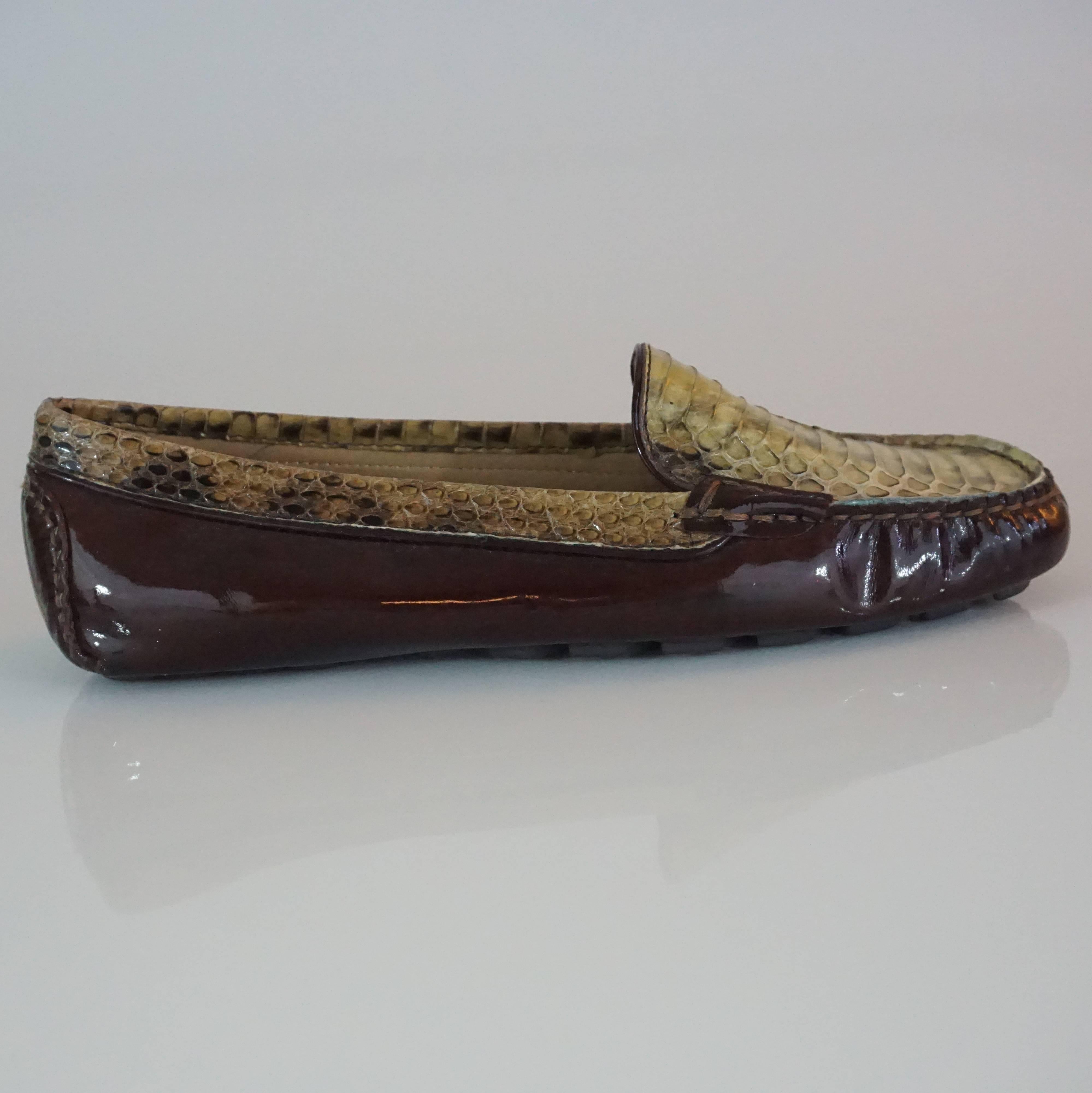 These Salvatore Ferragamo loafers are brown patent leather with green snake skin. They have brown stitching and are a size 5. They are in excellent condition. 