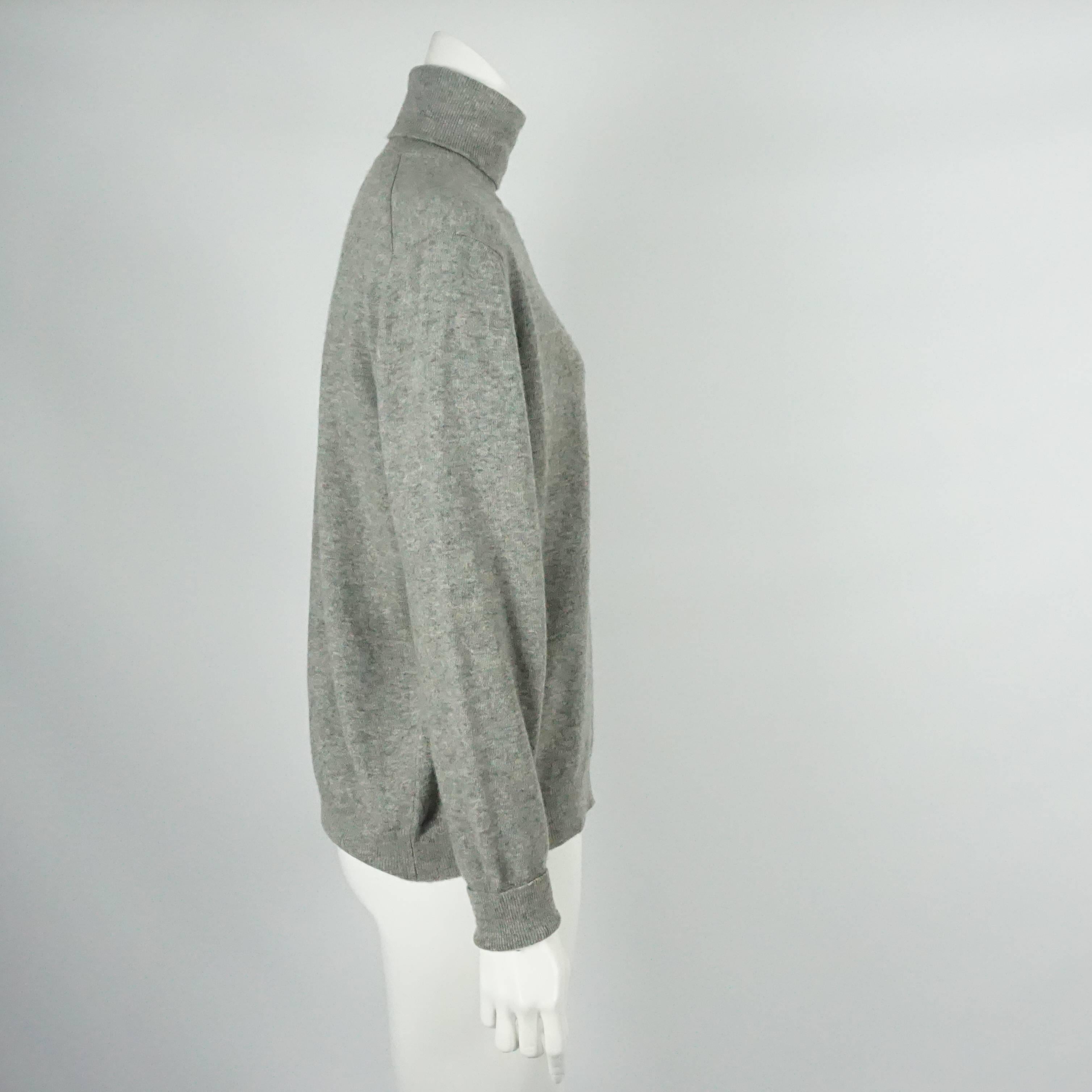 Hermes Vintage Gray Cashmere Turtleneck Sweater - 44 - Circa 1960's / 1970's. This beautiful Hermes turtleneck sweater is made of gray cashmere. It is in very good condition and is perfect for a chilly day!

Measurements
Shoulder to Shoulder:
