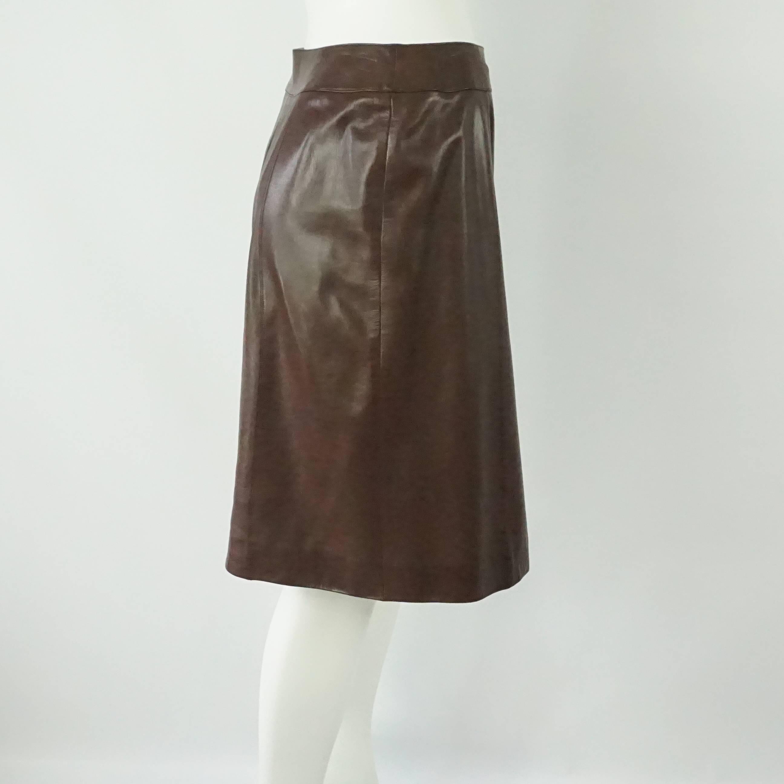 Chanel Brown Lambskin Wrap Skirt - 40 - 01A. This beautiful skirt is perfect for fall and a great staple to amp up any outfit. It has 4 buttons in the front towards the side with a 