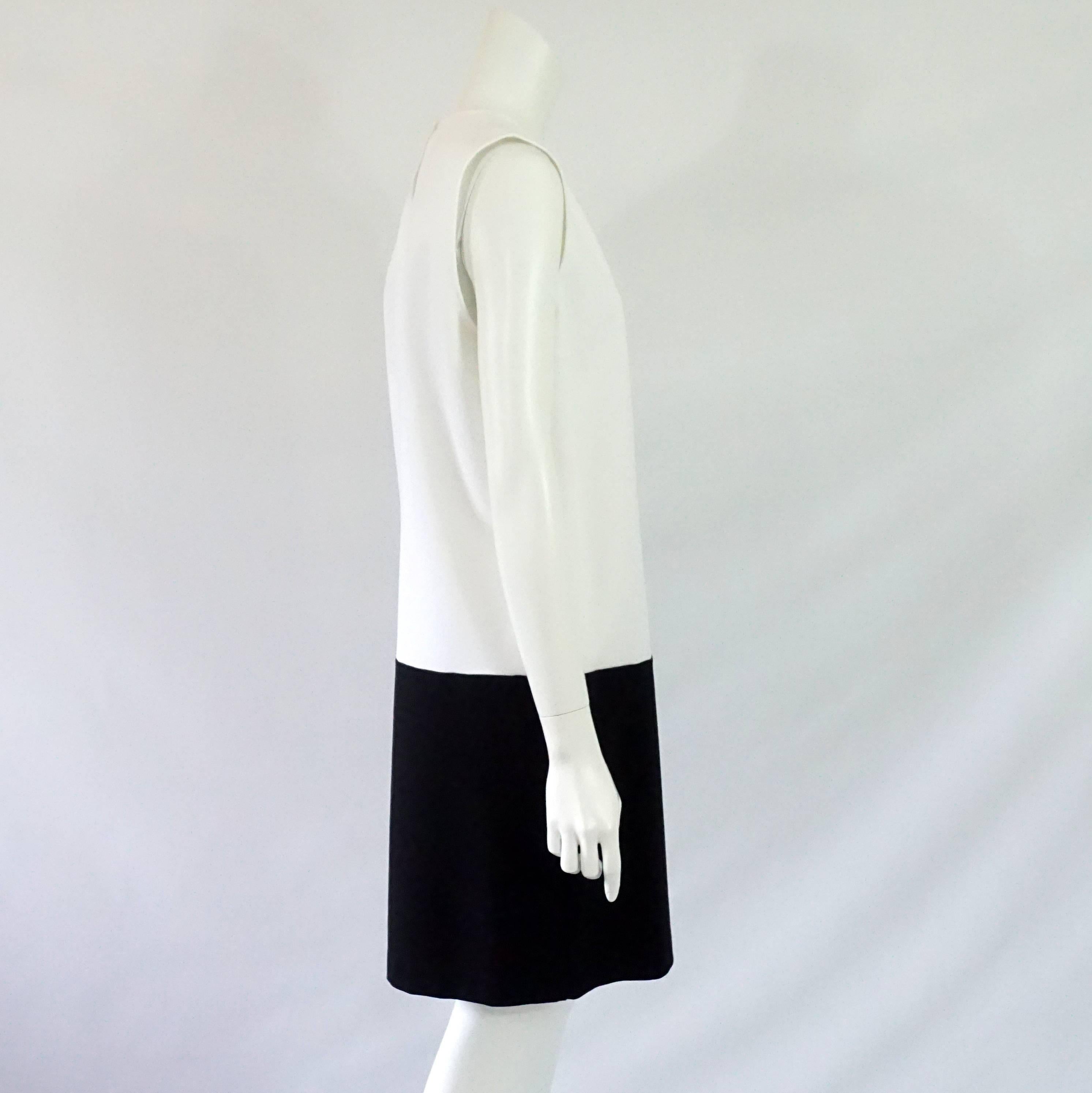 Gucci Black & White Sleeveless Shift Dress - XL - NWT  This sleeveless shift dress is made of a thick viscose/rayon blend, with the top being white and the bottom from the hip down black. It has a small gold gucci logo stitched on the left hip area.