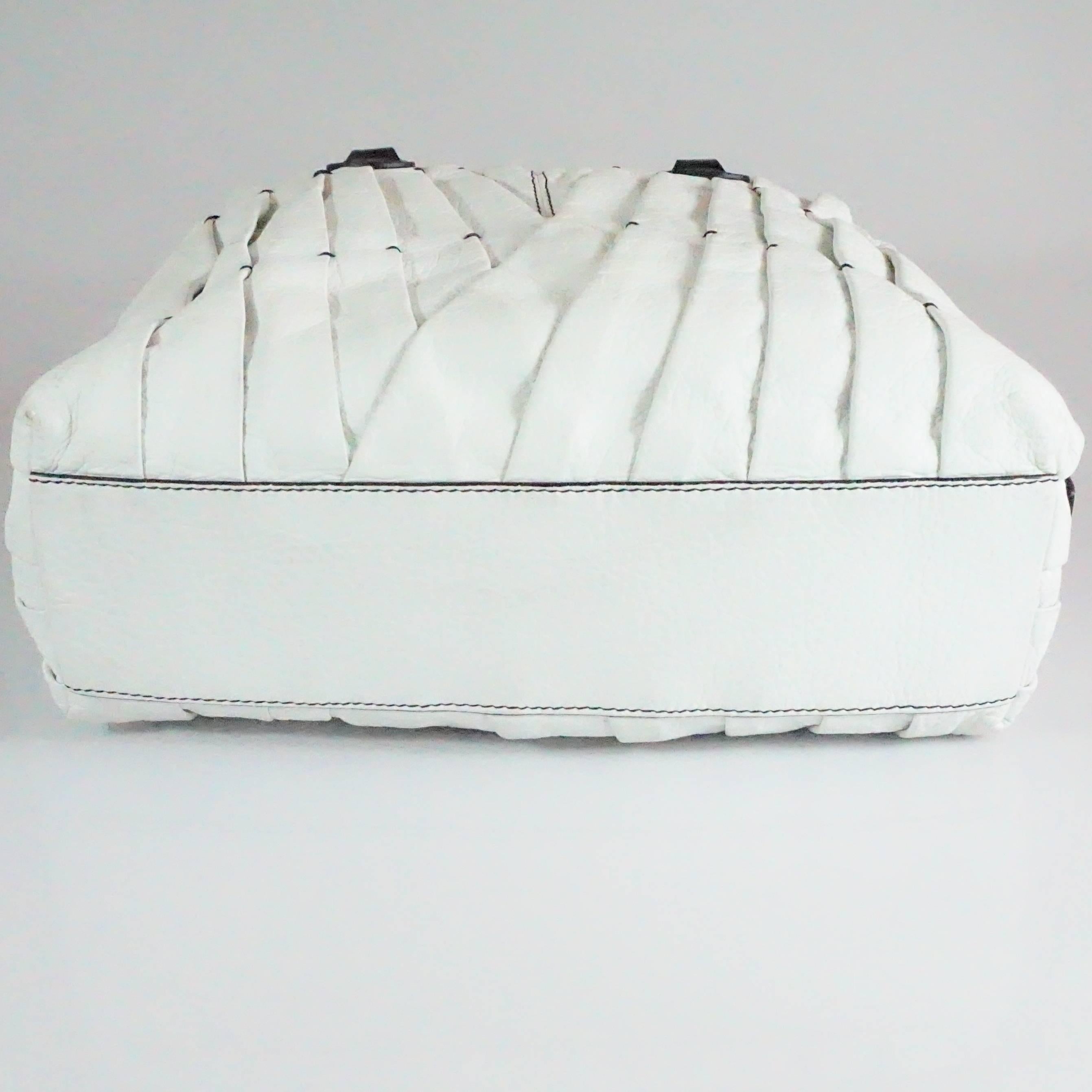 white leather handbag