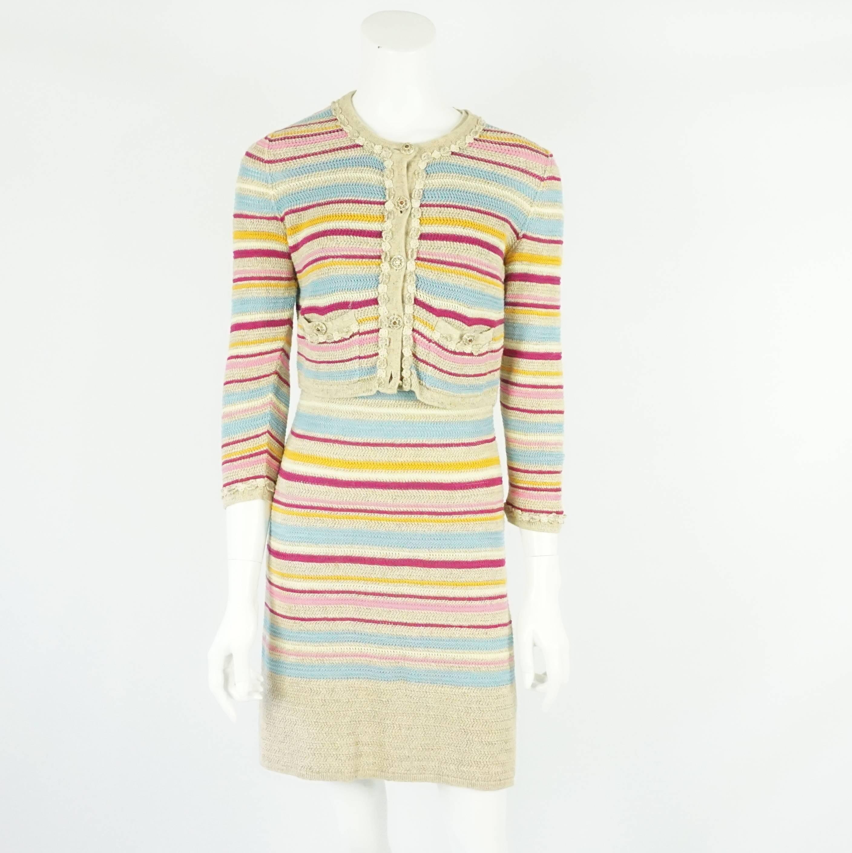 Chanel Tan and Multi-Colored Cotton Knit Striped Dress and Cropped Cardigan - 36. This beautiful set features a sleeveless dress with a round neckline, a key hole on the back and a button on the back. The cropped cardigan has 5 buttons down the