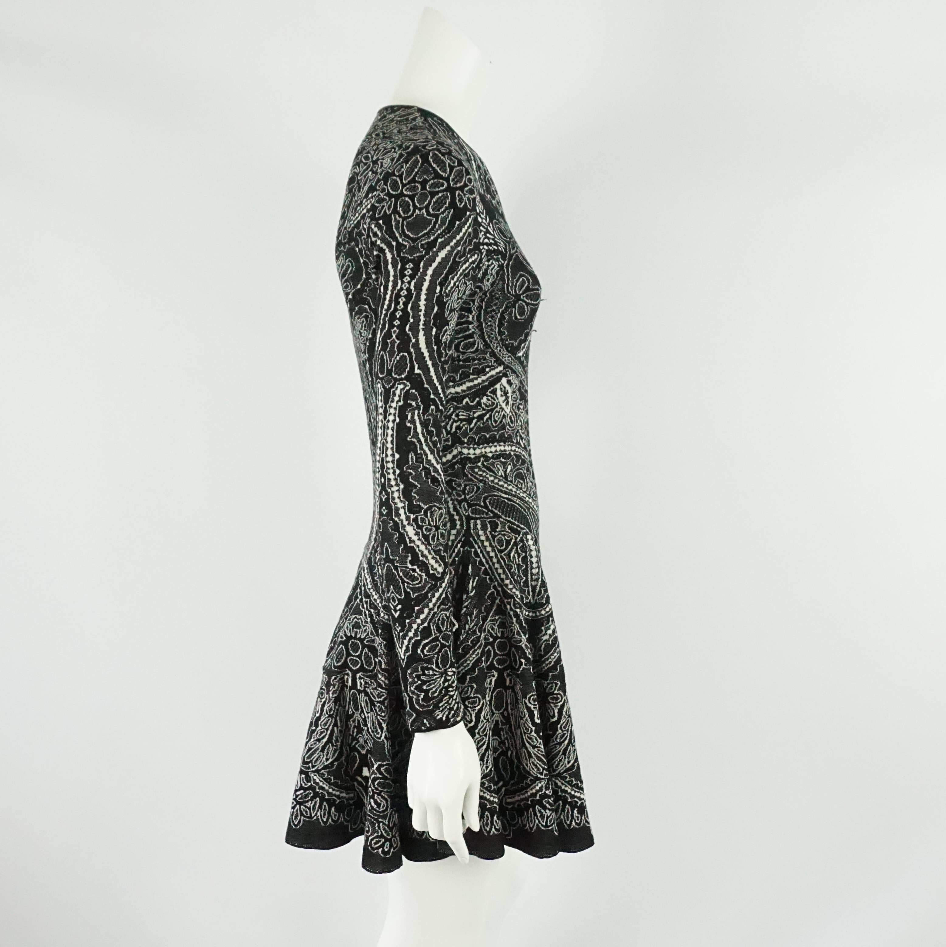 Alexander McQueen Black and Ivory Patterned Silk Knit Dress - Small  This long sleeve, round collar silk/wool blend knit dress is fitted to the waist and then the skirt flares out. The dress is in excellent condition.
Measurements:
Bust: