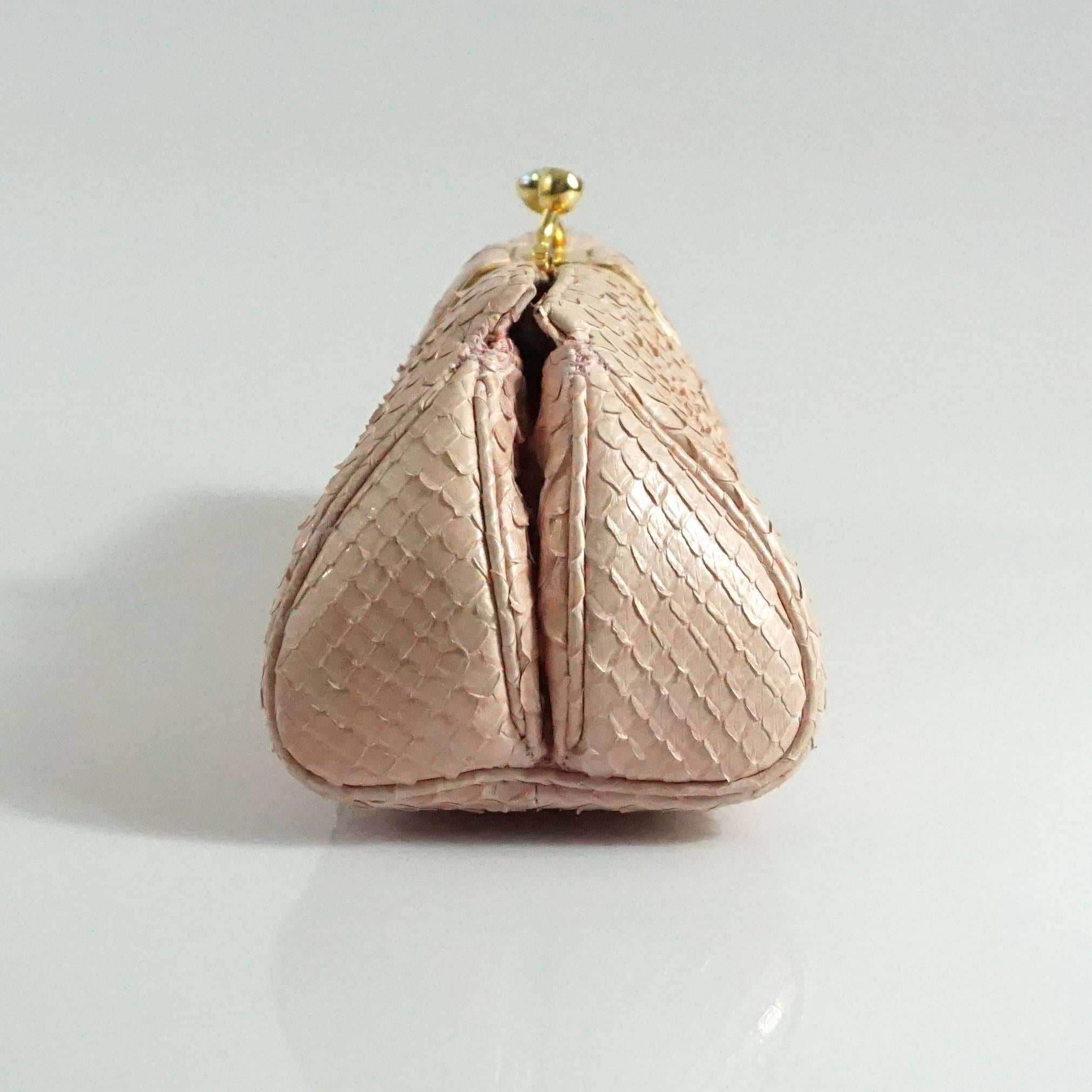 Judith Leiber Pink Snakeskin Handbag-GHW and detail on bag.  This handbag can be worn as a clutch or can be worn with the chain over the shoulder. The bag has a rhinestone detail on the clasp. It has a small pink satin coin purse. It has one main