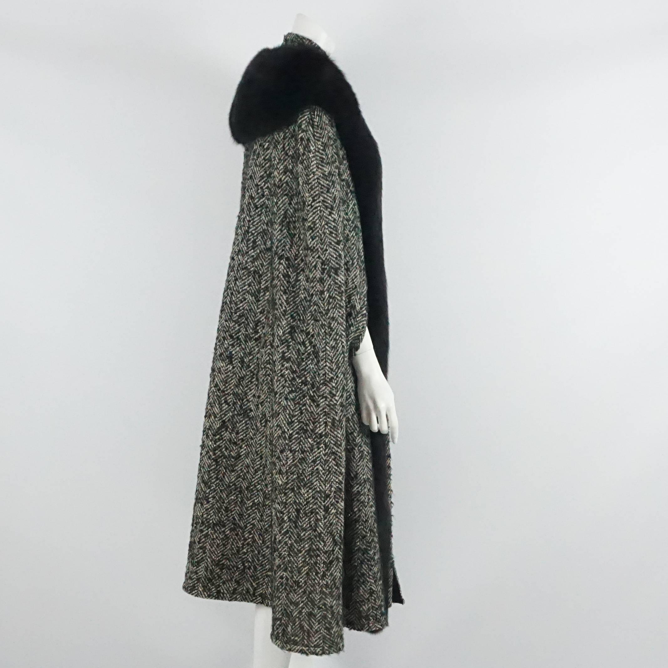 Bob Mackie Grey & White Herringbone Wool Tweed Cape w/ Black Fox Trim-10  Circa 70's  This fabulous cape is in excellent vintage condition, it has front slits for the arms to come out of, and is trimmed along the front and the back of the neck with