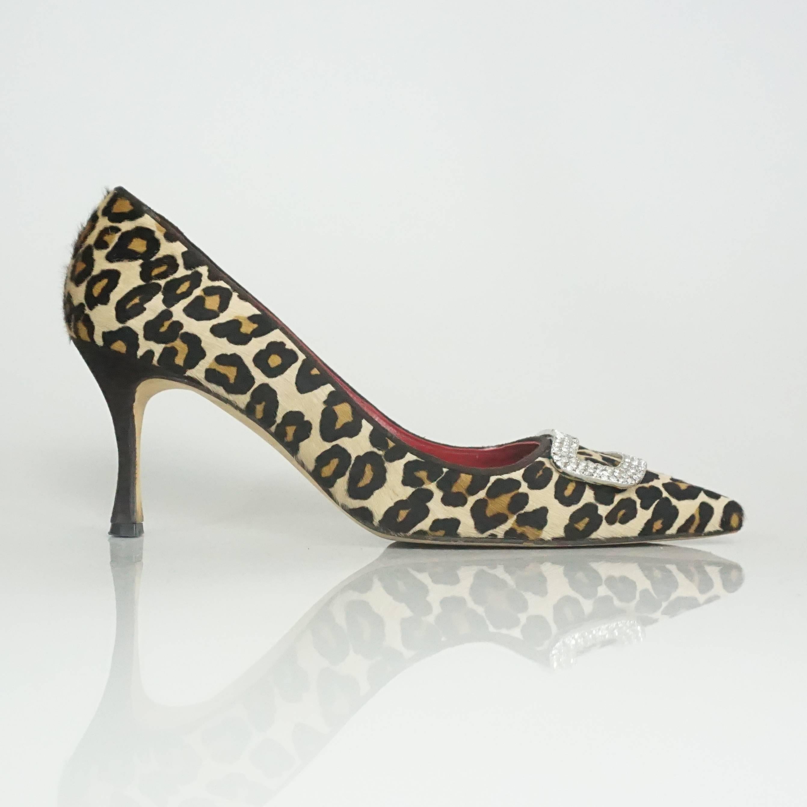 Manolo Blahnik Leopard Pony Hair Pump with Rhinestone Buckle - 40. These fun pumps are leopard printed pony hair. They are tan, light brown, and black in color with a large rhinestone buckle at the toe. The toe is pointed. They are in excellent
