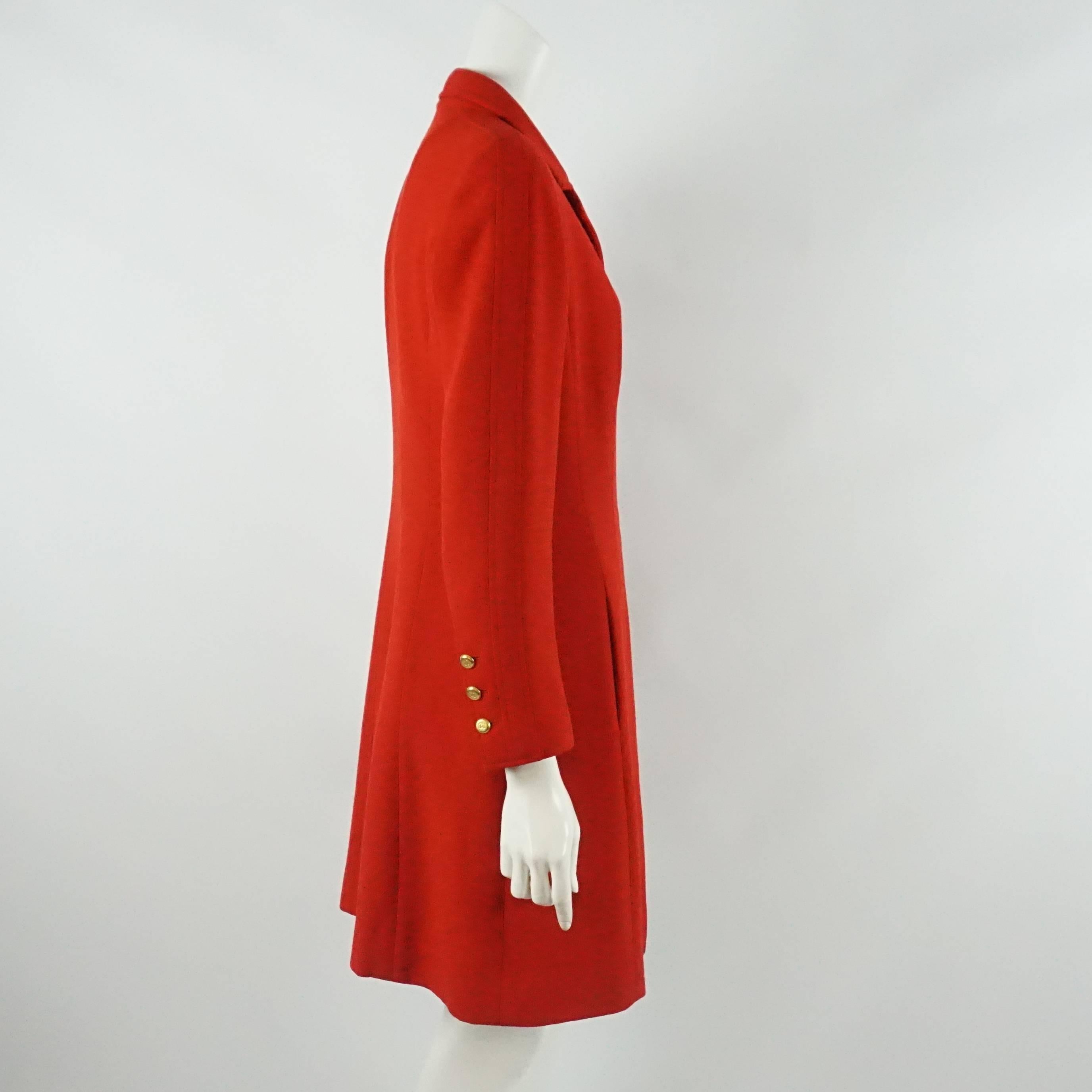 Chanel Red Double Faced Wool Coat Dress - 40 - 96A. This beautiful coat dress is red with hook and eye closures down the middle. There are 3 CC gold colored buttons on each sleeve. This dress is in very good condition vintage condition, with a very