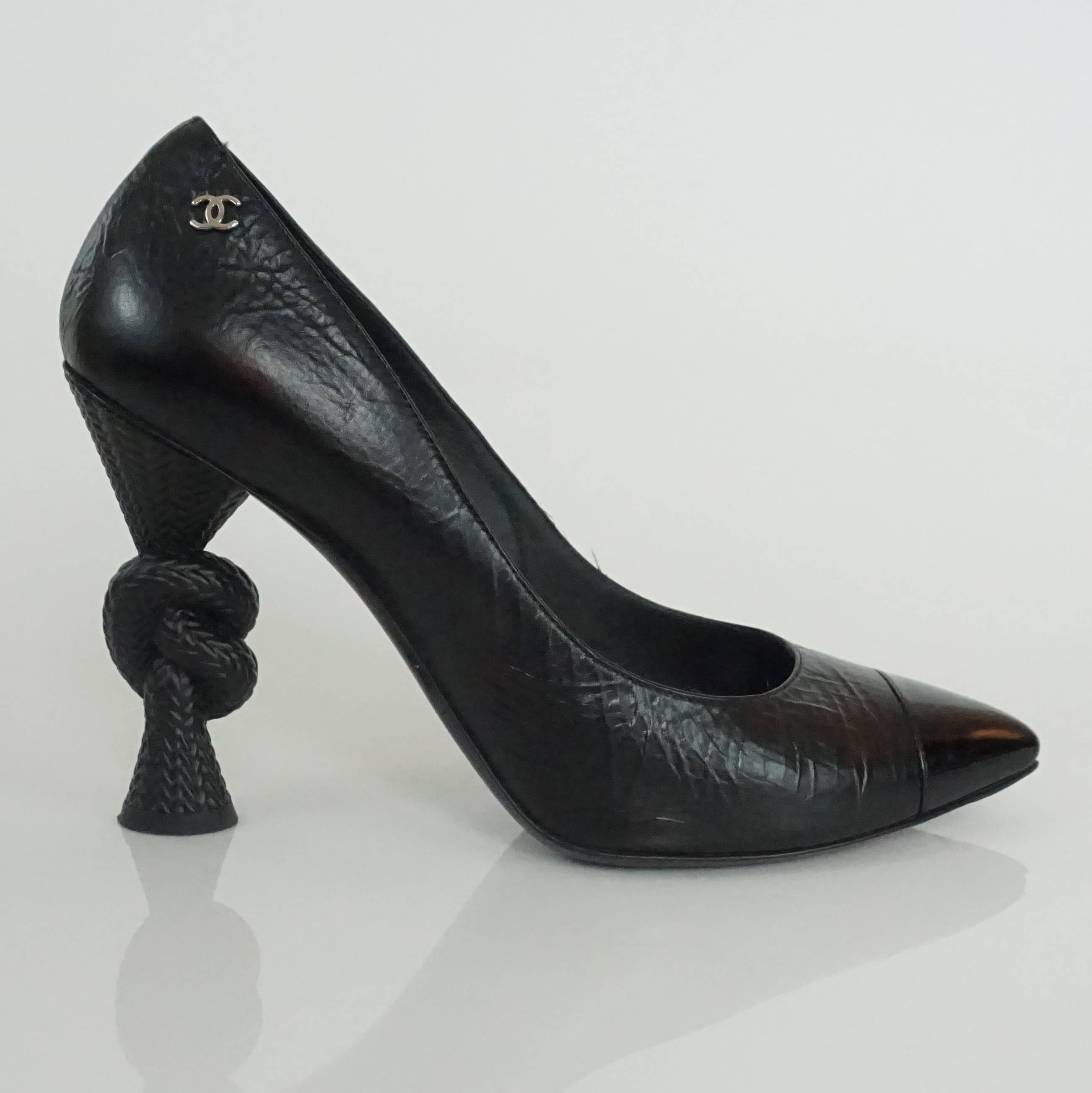 Chanel Black Leather and Patent Pump w/ Rope Heel - 40.5 These spectacular and classy shoes are a distressed leather look with a patent toe, silver cc detail and a rope knot heel. These shoes are in excellent condition.
Heel Height: 4.5