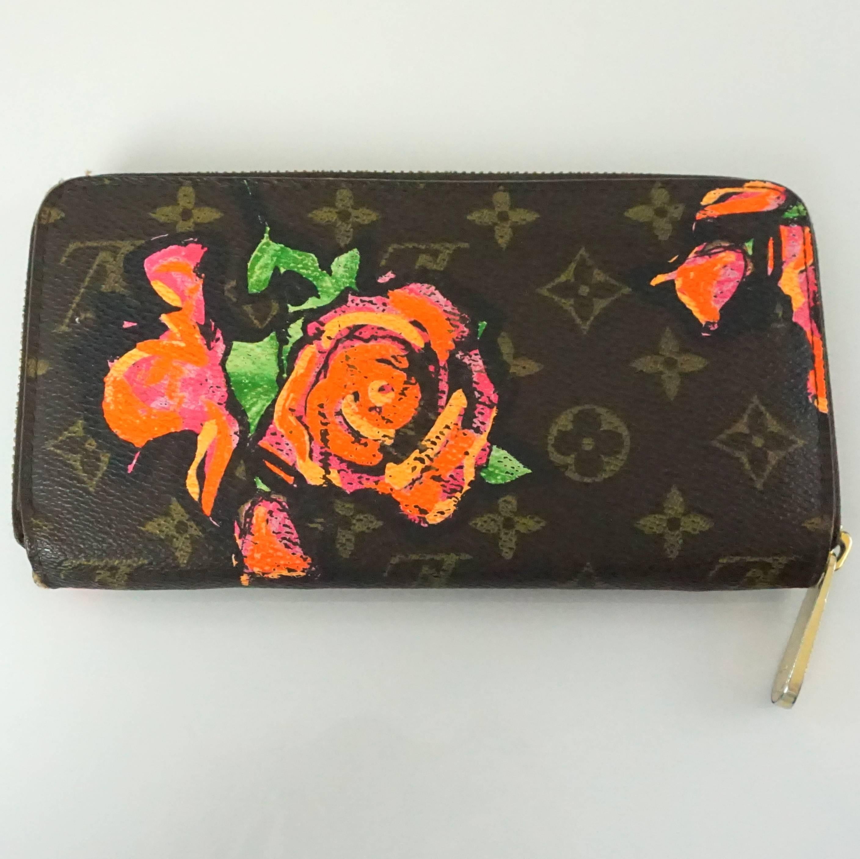 Louis Vuitton Brown Monogram Stephen Sprouse Floral Wallet - 2009. This collectible, stunning wallet is a must have. It is in good condition with light wear to the outside and some tarnishing on the zipper. The zippy wallet features 8 card slots, 2