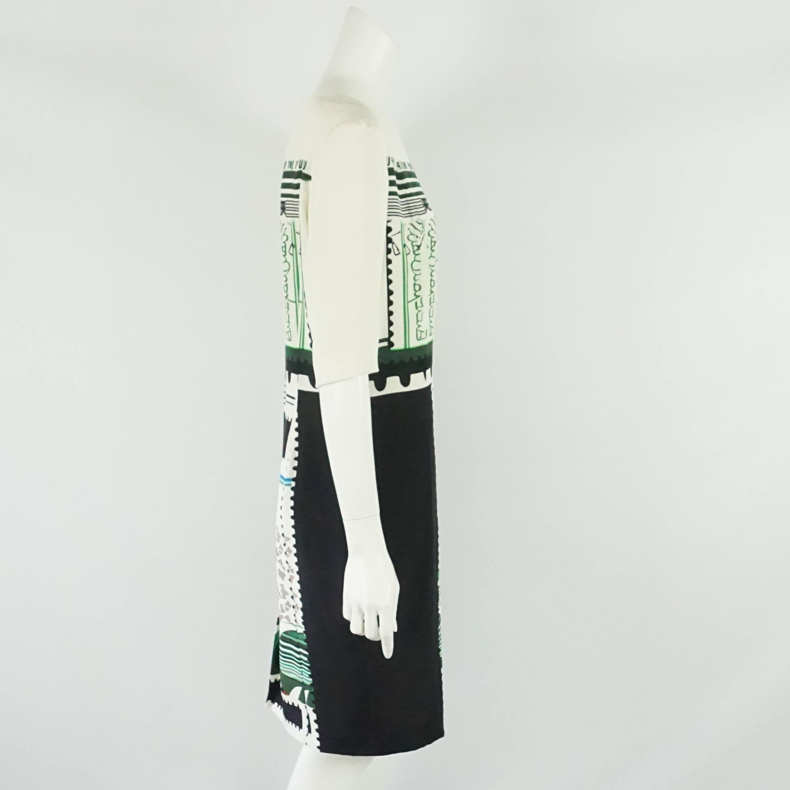 Mary Katrantzou Black and White Silk Printed Shift Dress - 14. This beautiful dress adds a little flare to the a classic style. It has 3/4 sleeves with a slightly fitted bodice and a small back slit. The dress is in good condition with a couple